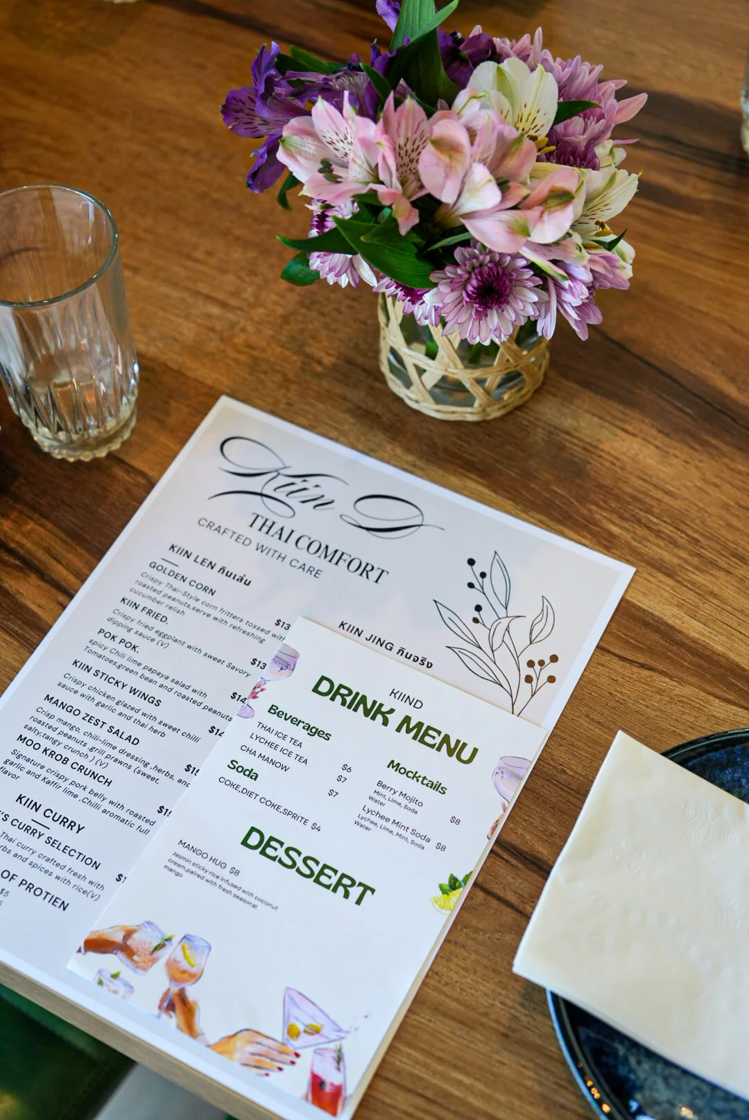Thai restaurant menu with floral decor and drink options