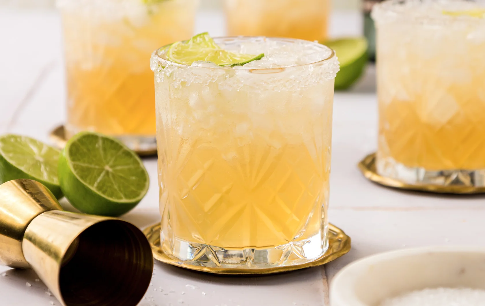 Refreshing margarita cocktails with lime garnish