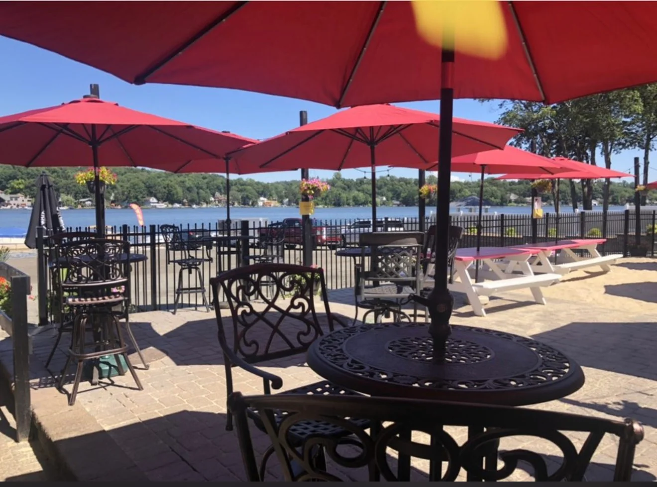 Mason Street Bar & Grille outdoor dining Lake Hopatcong NJ with red umbrellas waterfront seating and dock and dine access