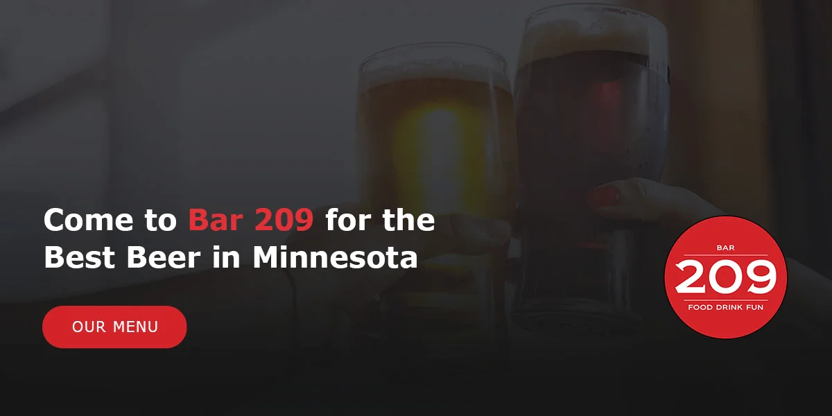 Two glasses of beer clinking together in celebration