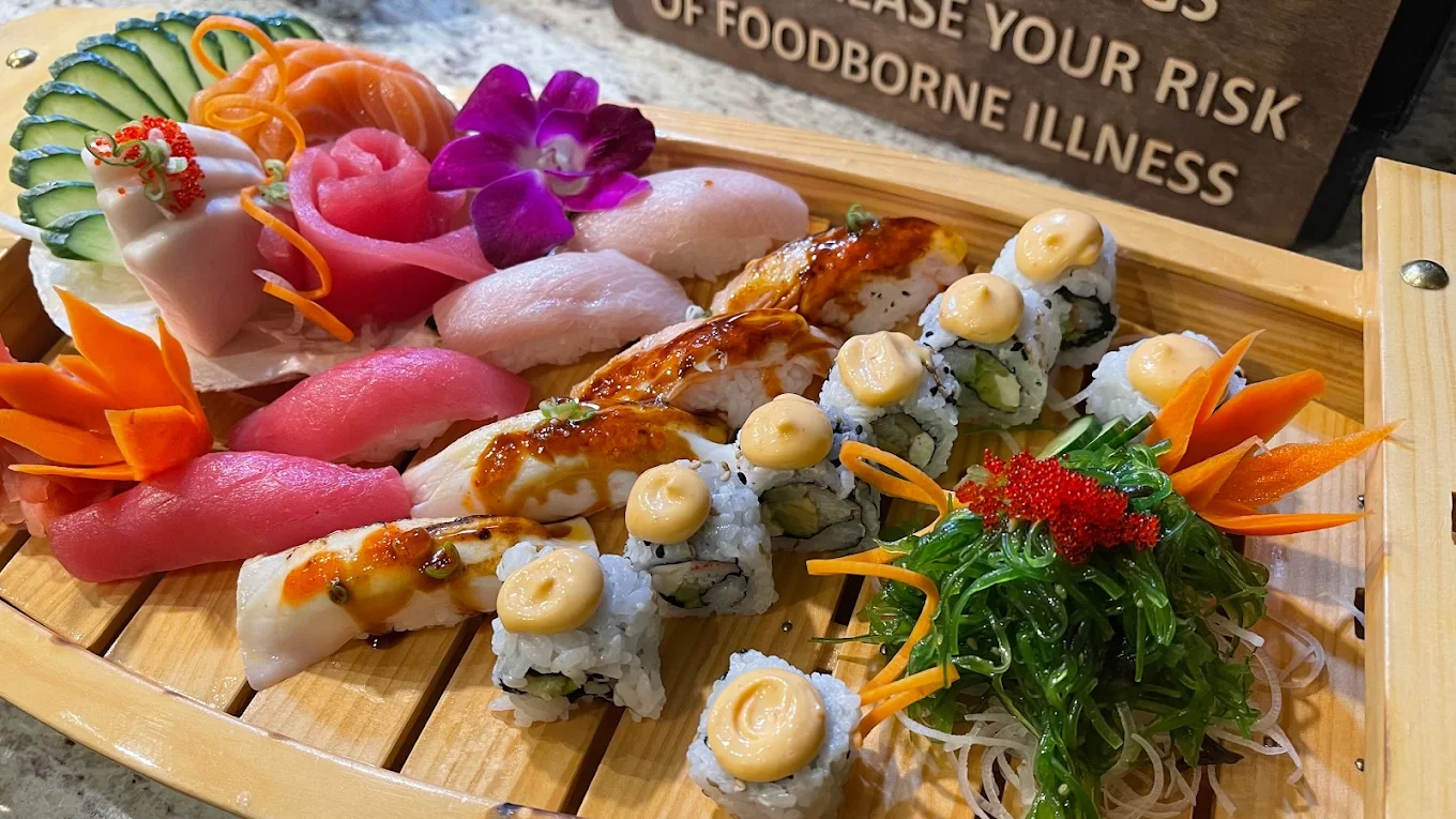 Assorted Japanese sushi platter with fresh sashimi and garnishes