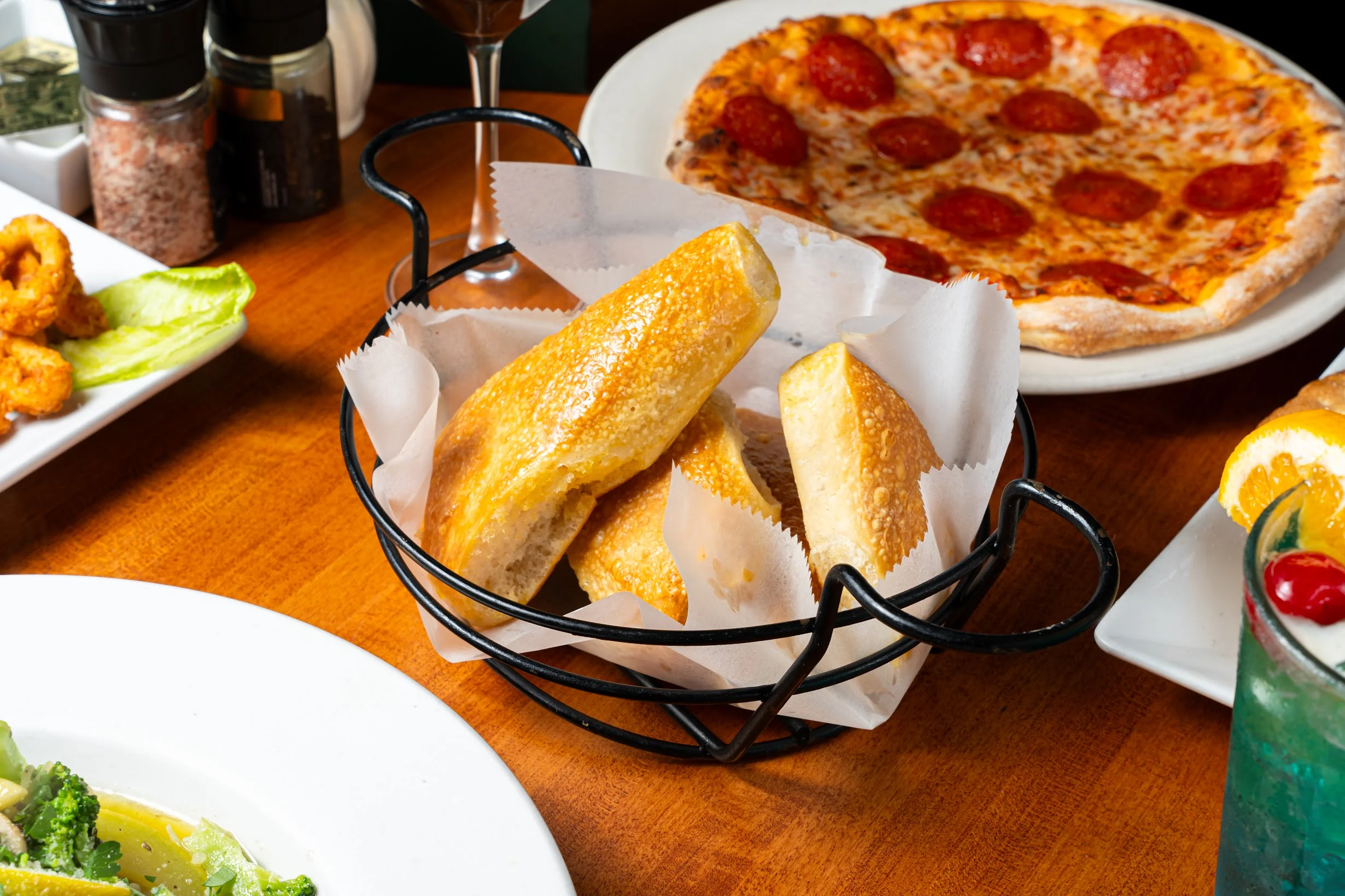Freshly baked house bread served on a wooden board.