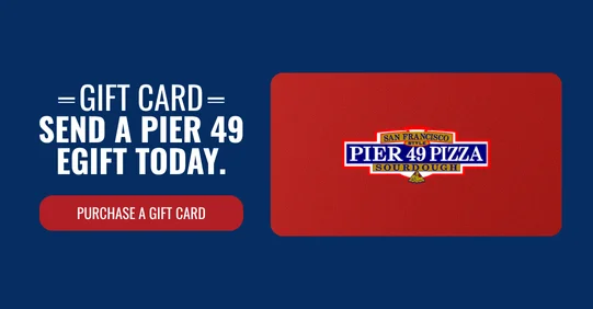 Gift cards for Pier 49 Pizza displayed on a wooden table.