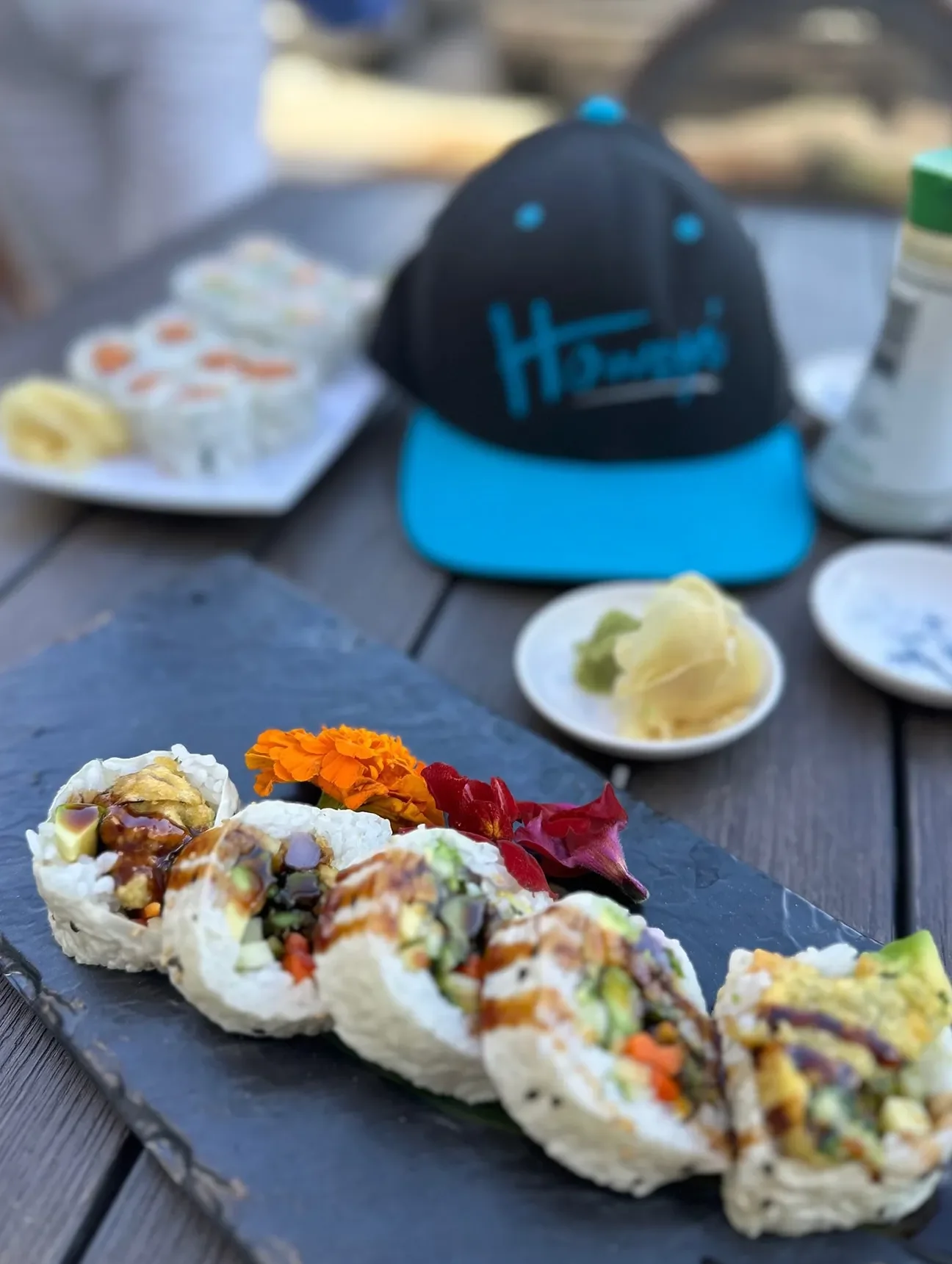 Artfully arranged sushi rolls on a slate platter