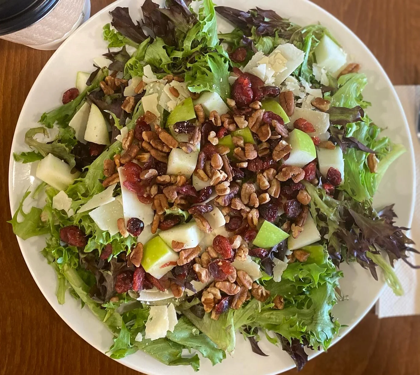 Fresh garden salad with nuts and cranberries