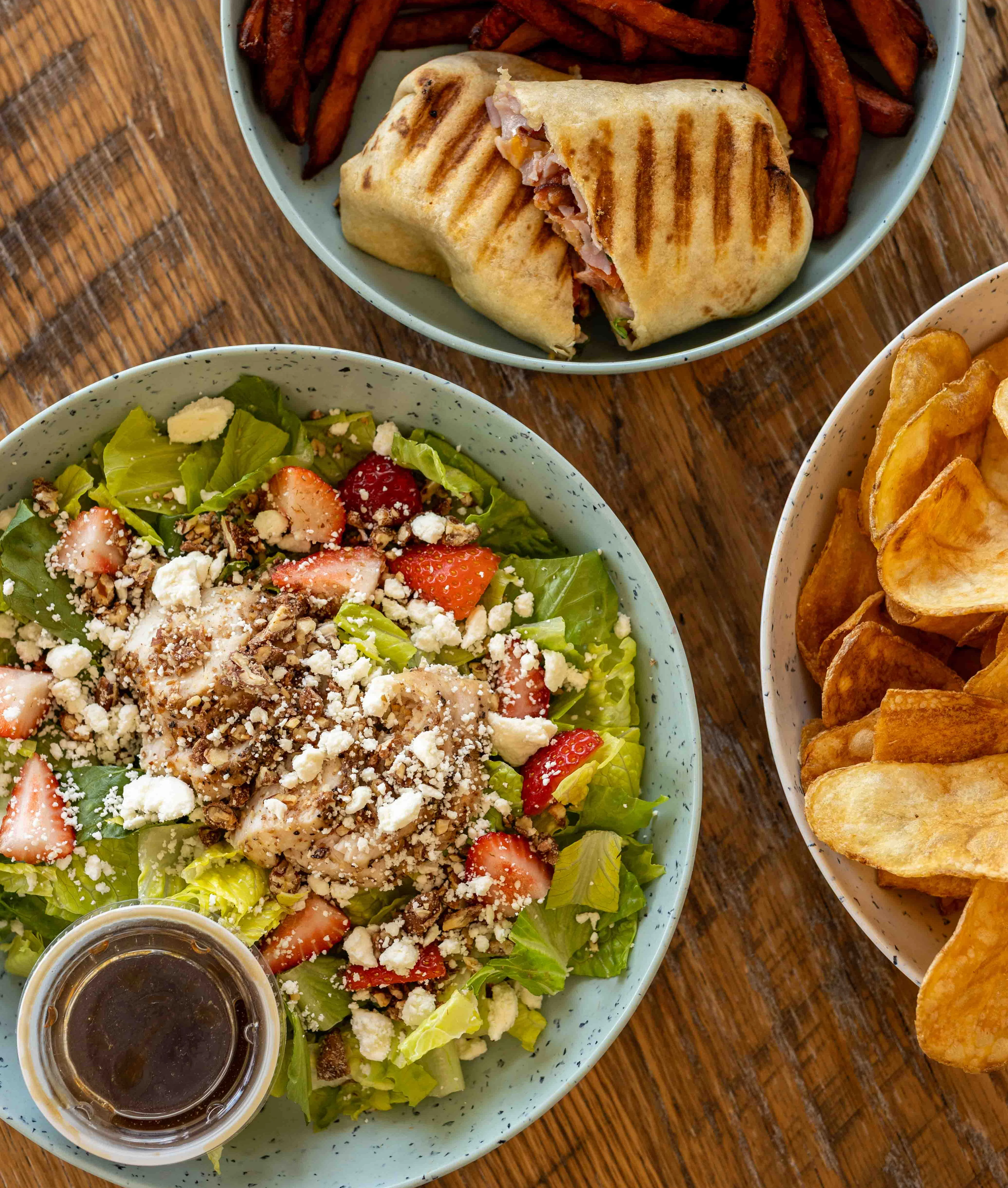 Fresh garden salad with strawberries and grilled wrap