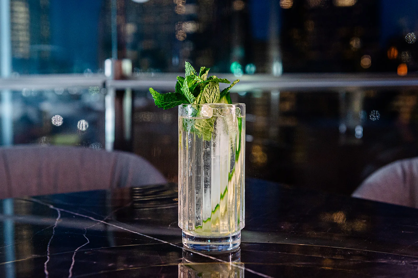 Refreshing mint cocktail in a tall glass with ice