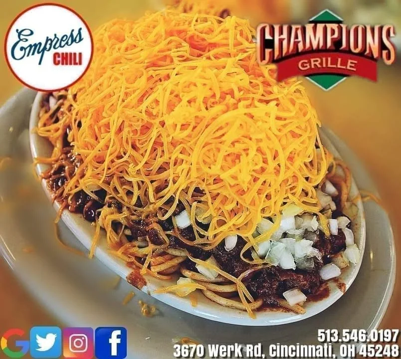 Cincinnati-style chili spaghetti topped with shredded cheese