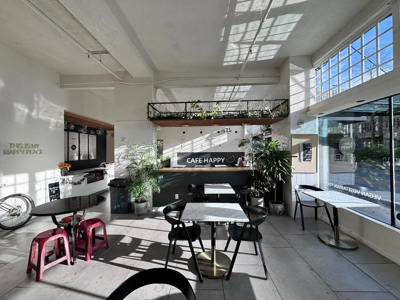 Bright and inviting cafe interior with plants and modern decor