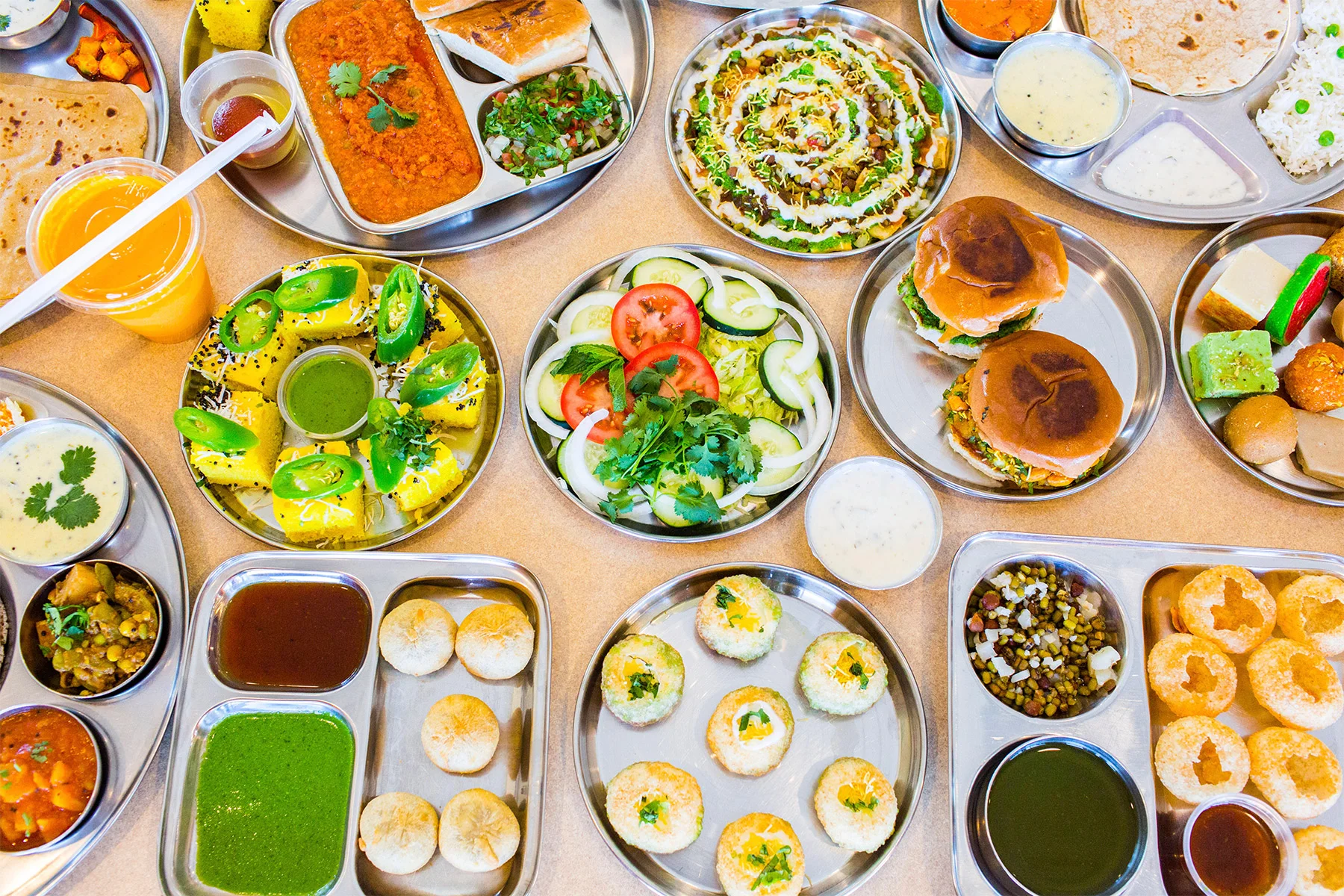 Assorted Indian street food platter with snacks and curries
