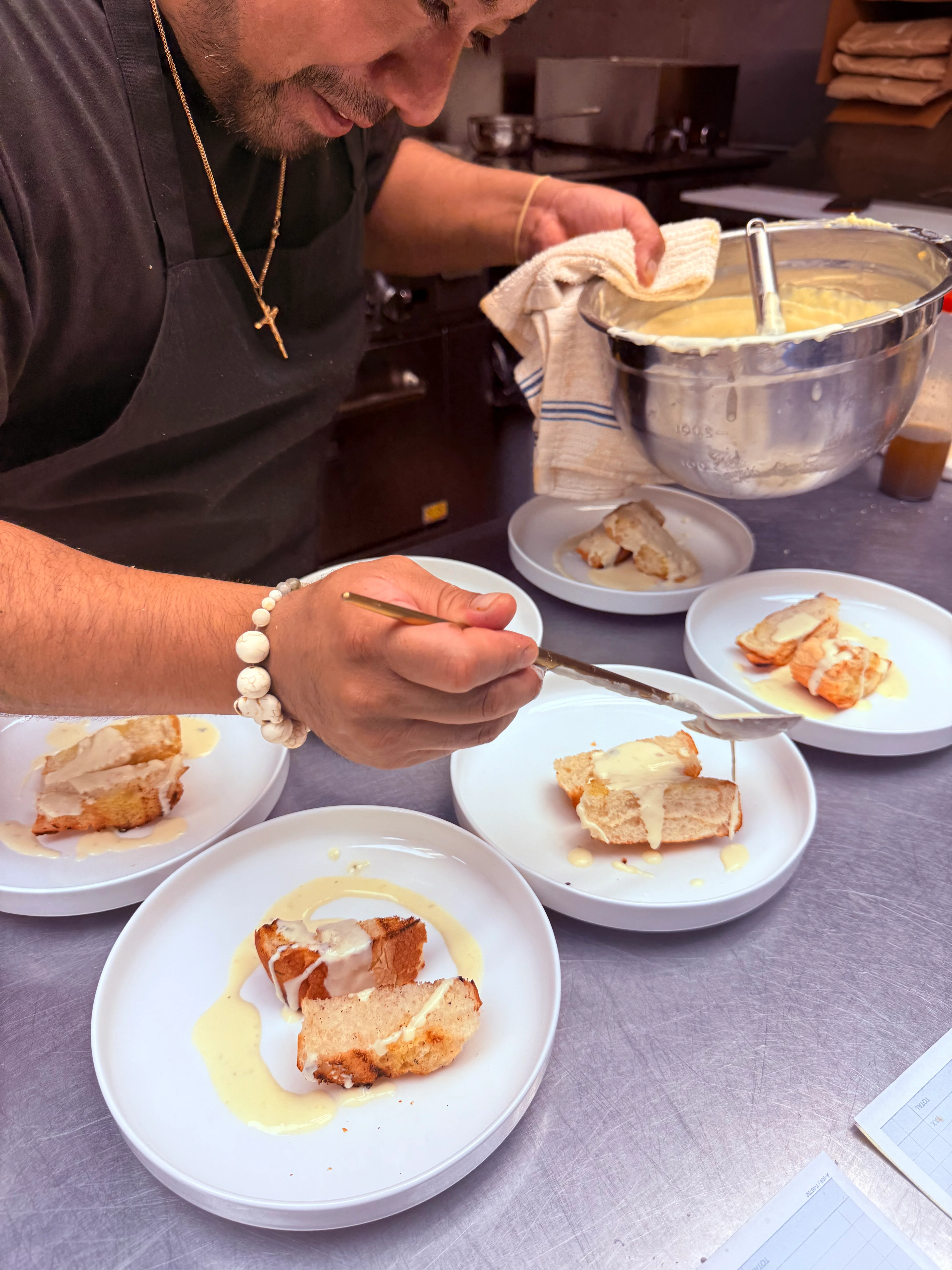 Plated tres leches cake with creamy sauce
