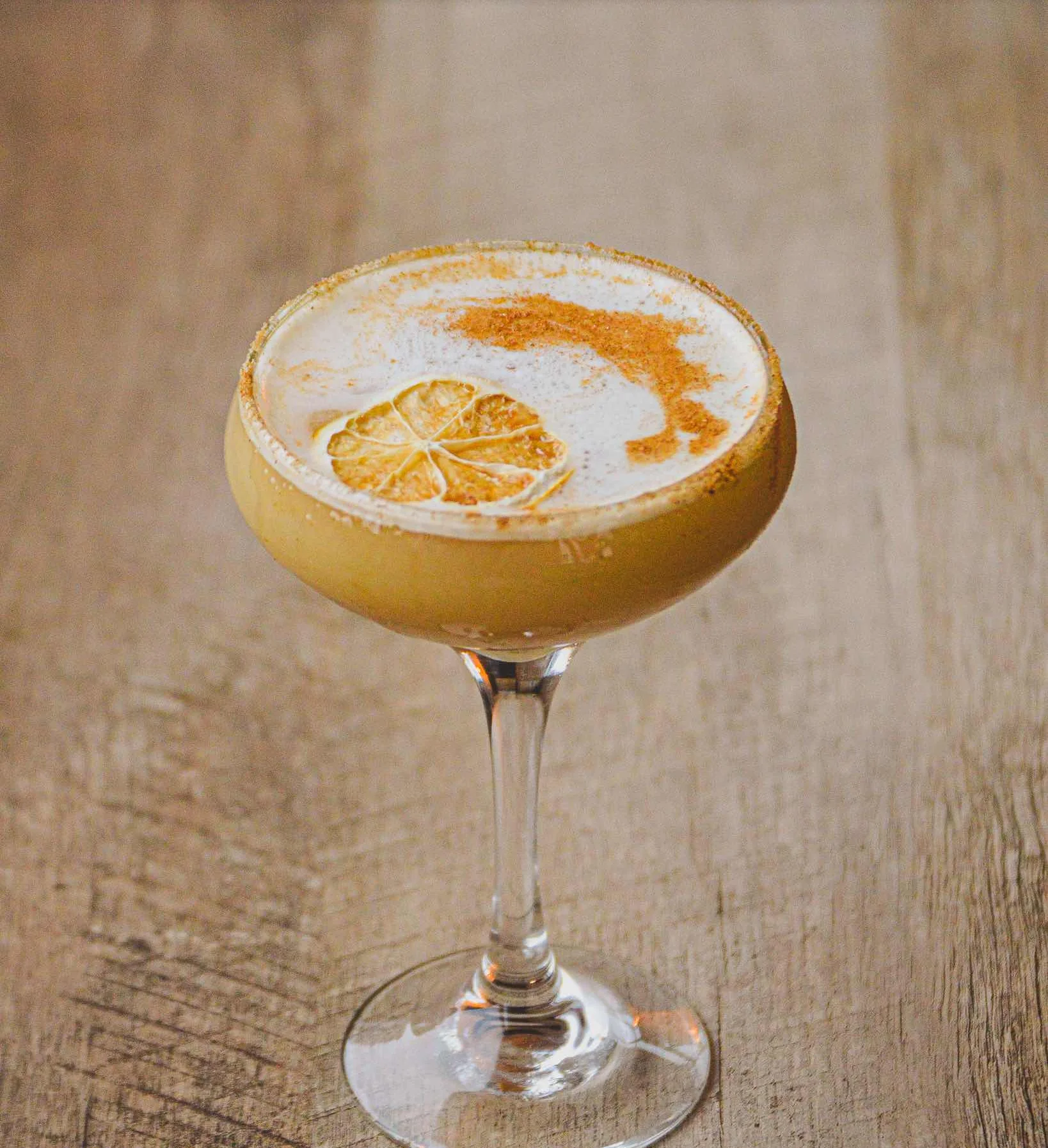 Maple Sour cocktail on a wooden table