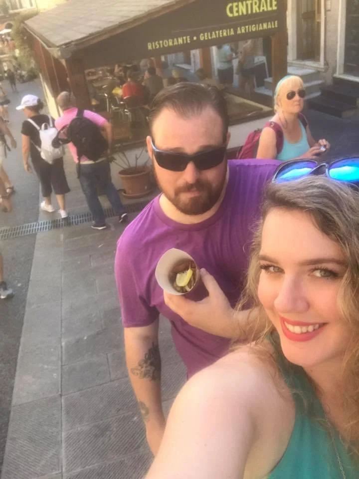 Couple enjoying gelato in a vibrant street setting