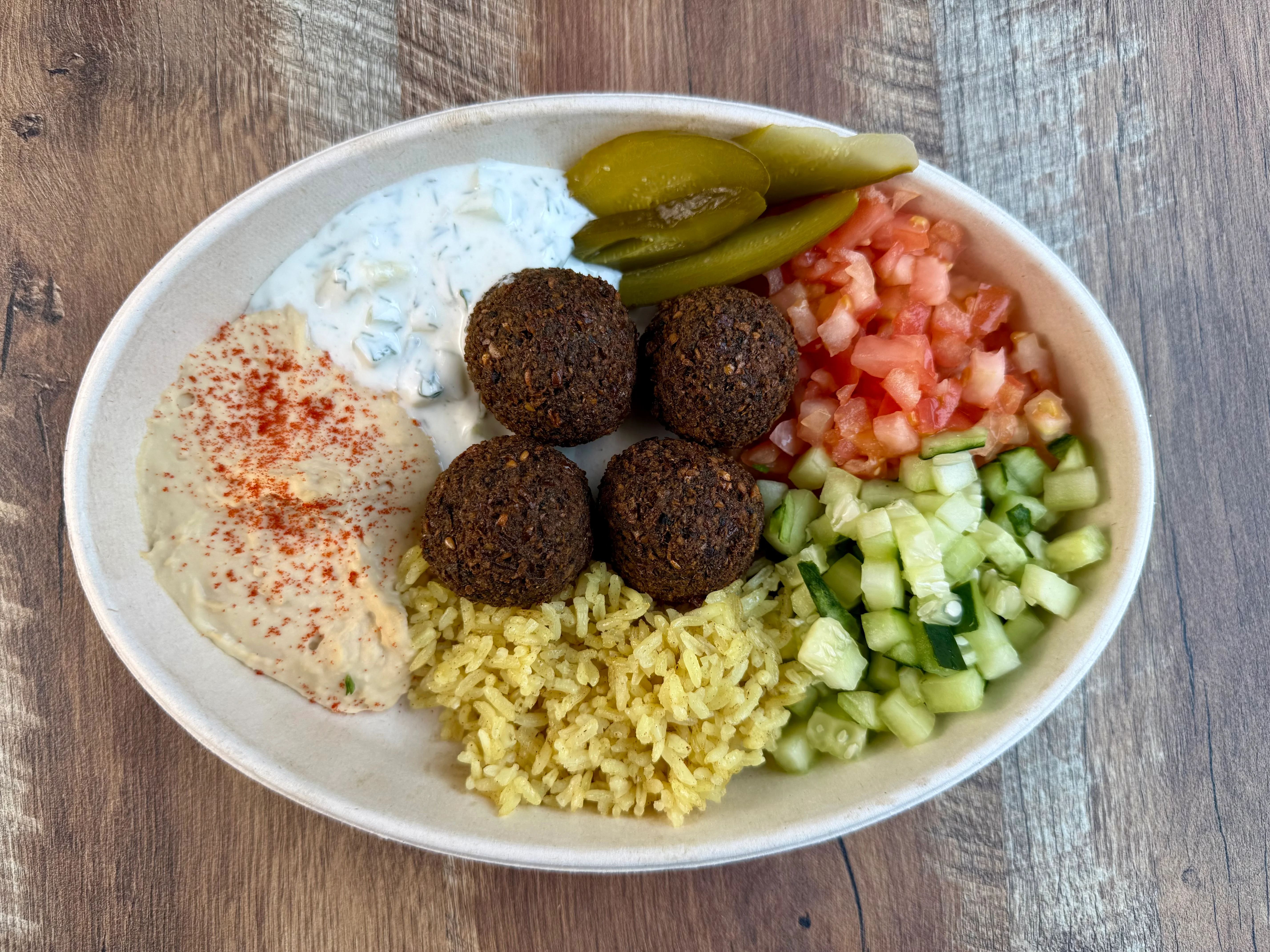 A beautifully arranged plate of gourmet food with vibrant colors and garnishes.