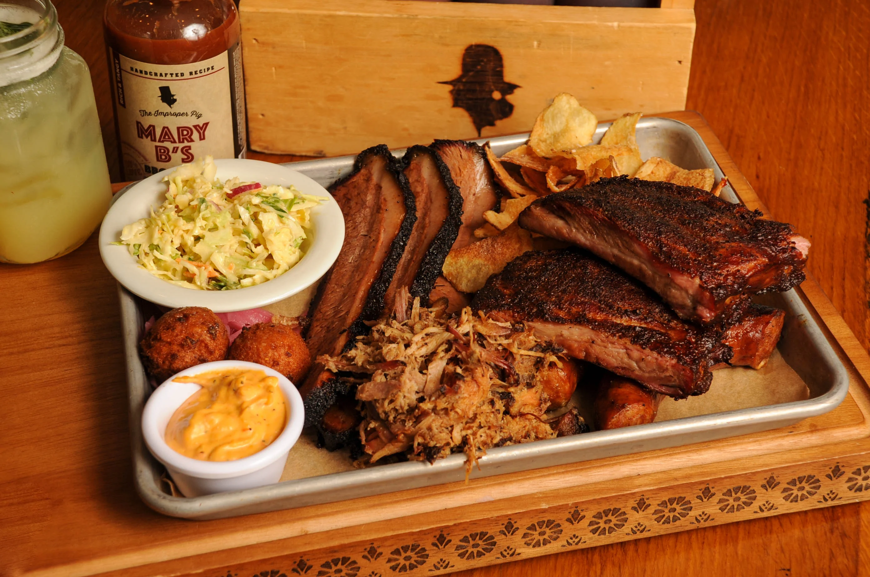 Platter of Texas-style barbecue with ribs and pulled pork
