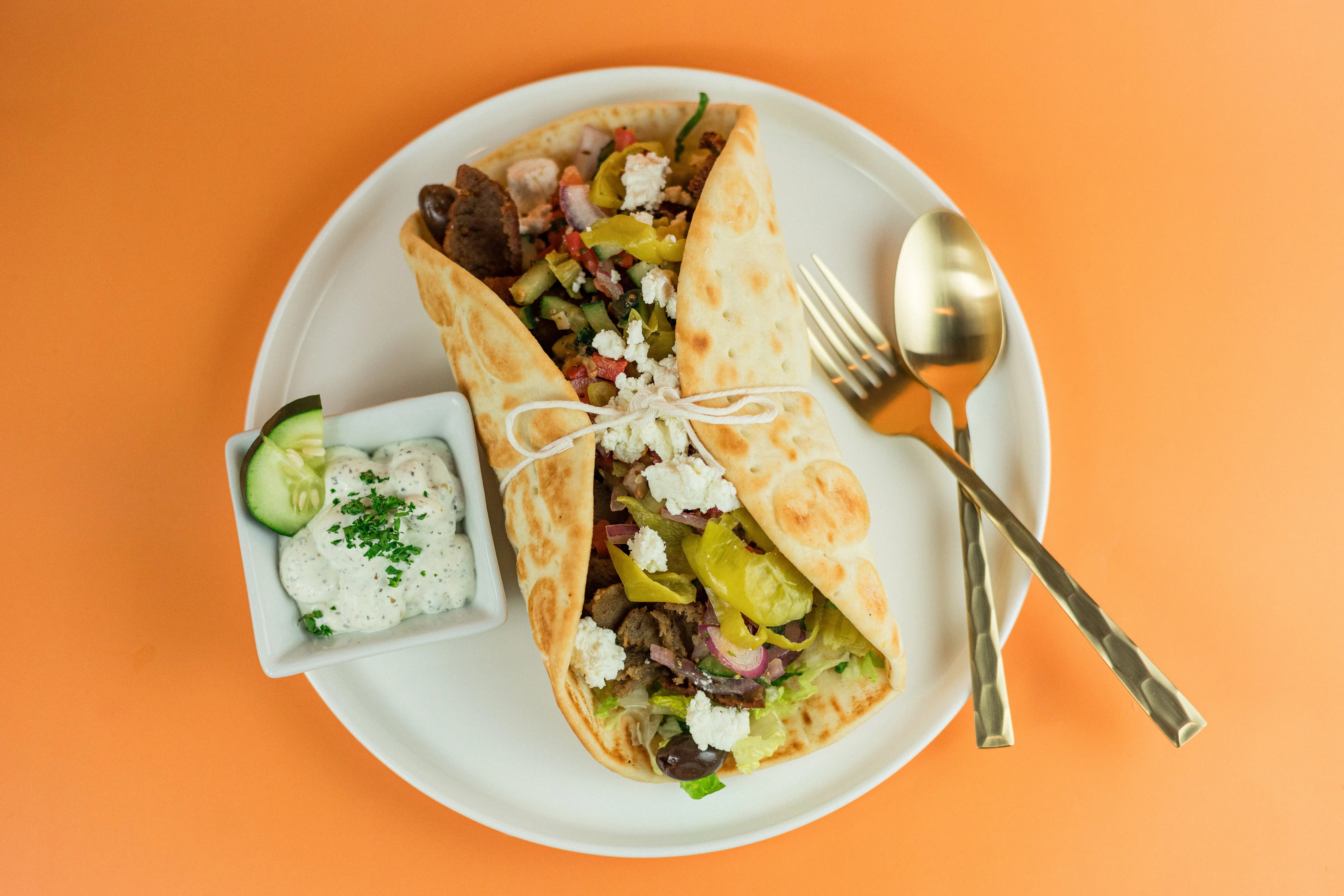 Original Greek pita with gyro meat roasted peppers and Tzatziki at Santorini's Sandy