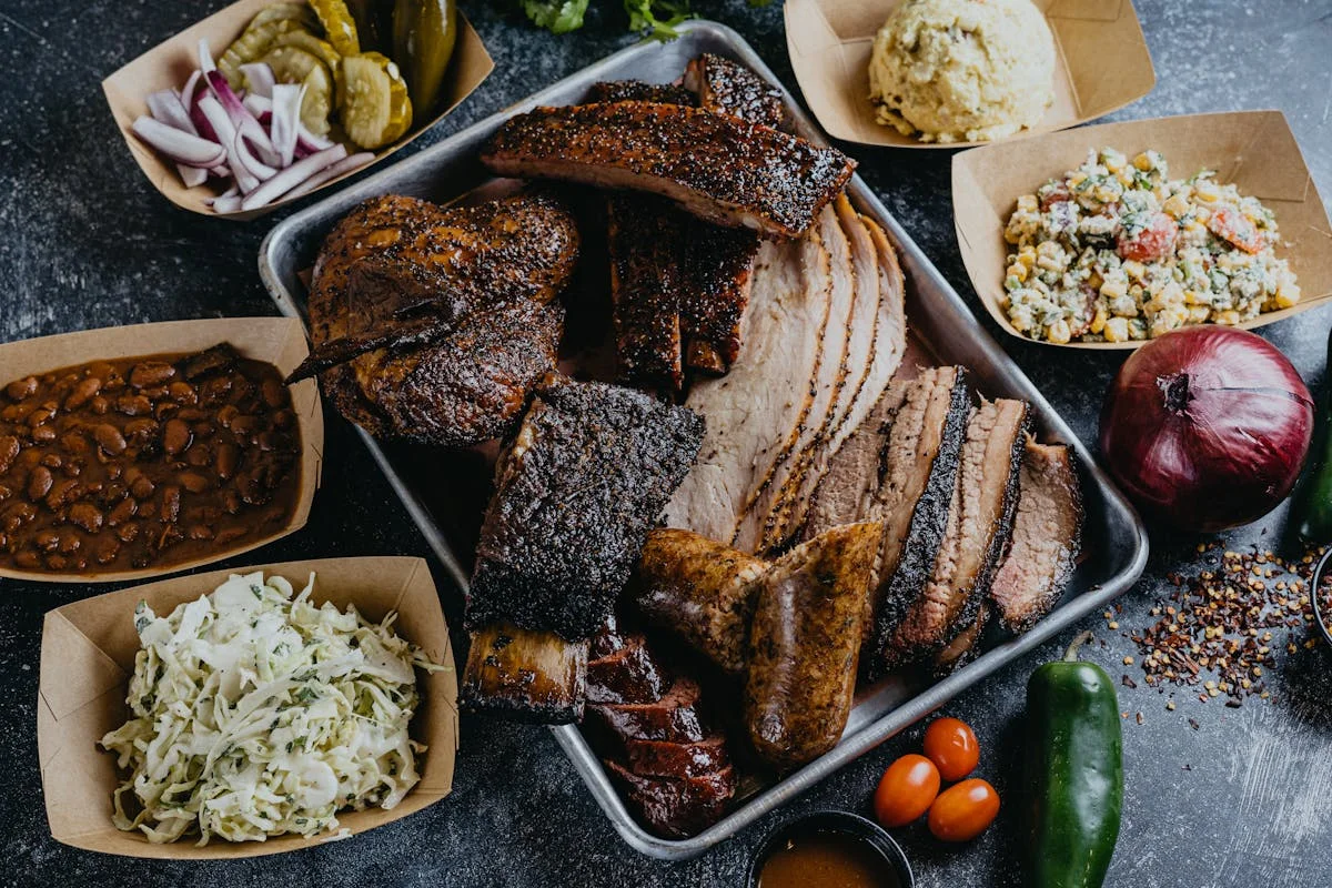Assorted Texas barbecue platter with smoked meats and sides