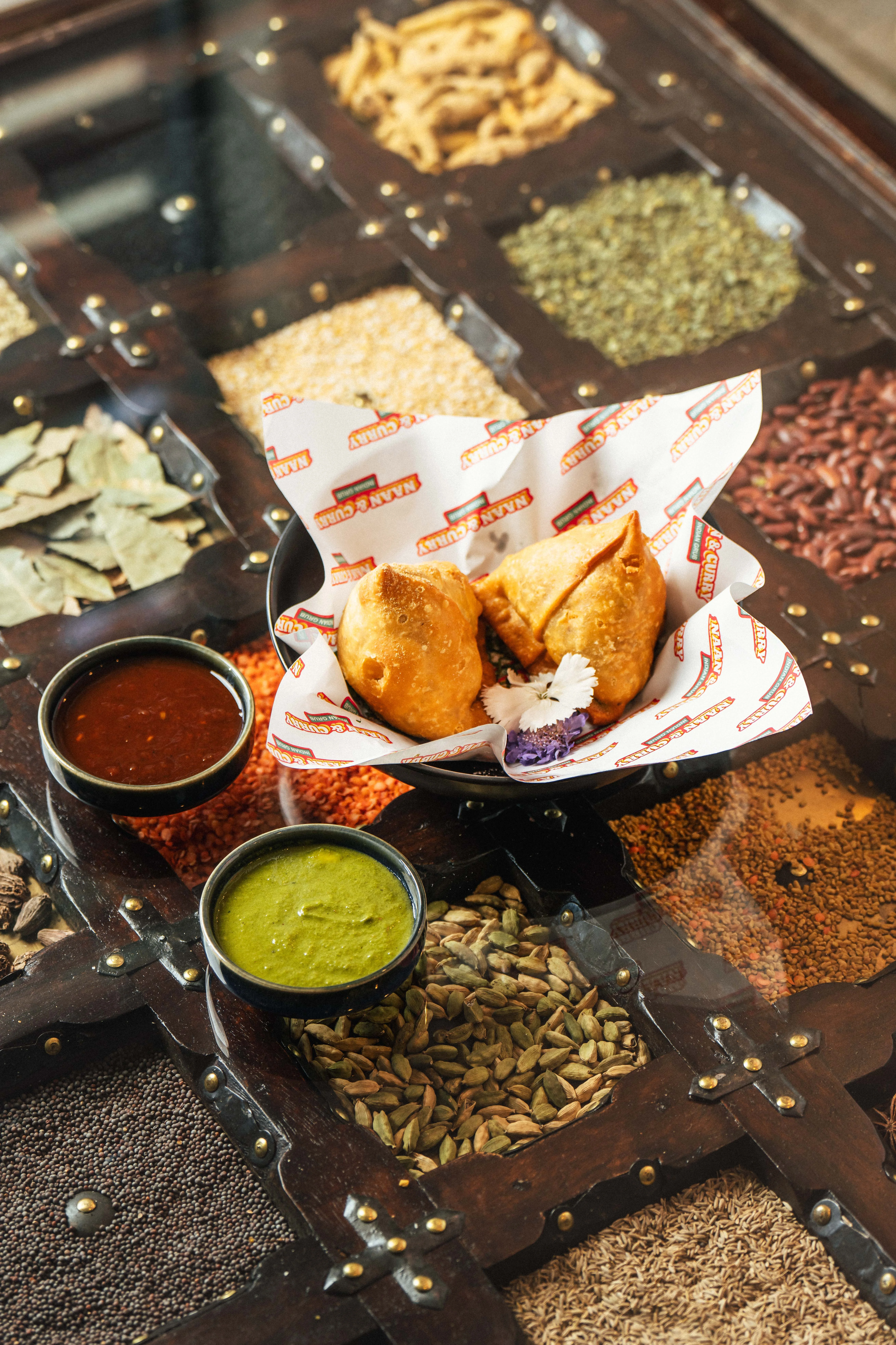 Two crispy vegetable samosas from Naan & Curry in Las Vegas — top-rated Indian restaurant for authentic street snacks and catering across the Vegas Valley.