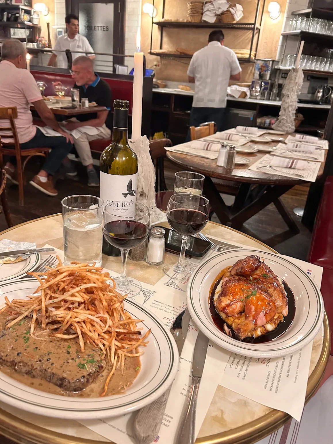 Classic French steak frites served in a cozy restaurant setting