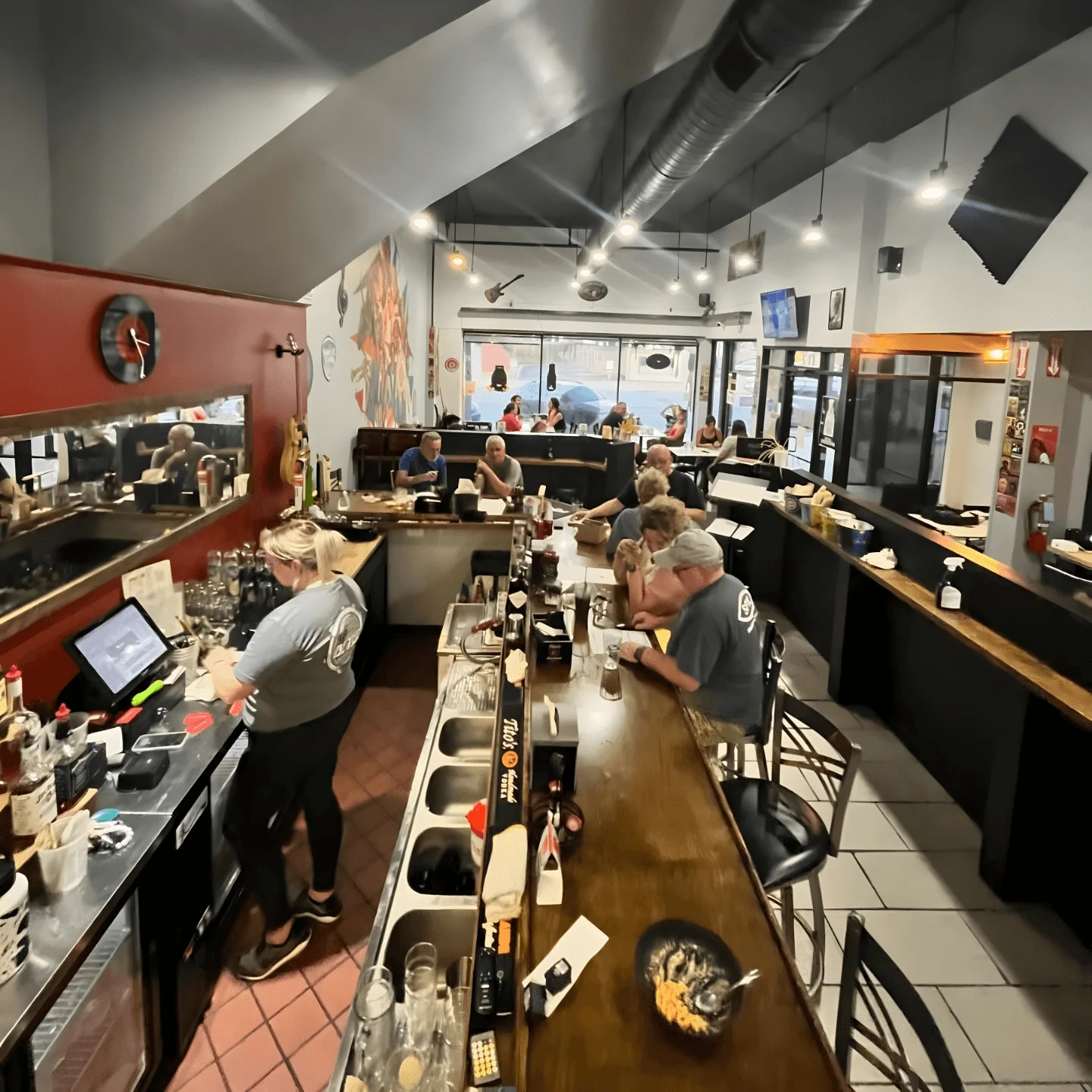 Cozy restaurant interior with patrons enjoying meals and drinks