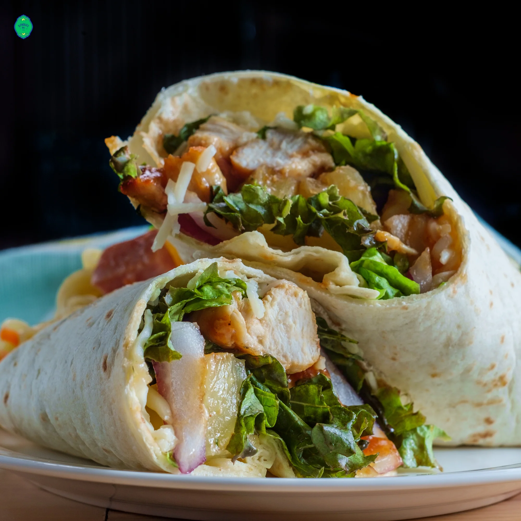 Grilled chicken wrap with fresh greens and vegetables