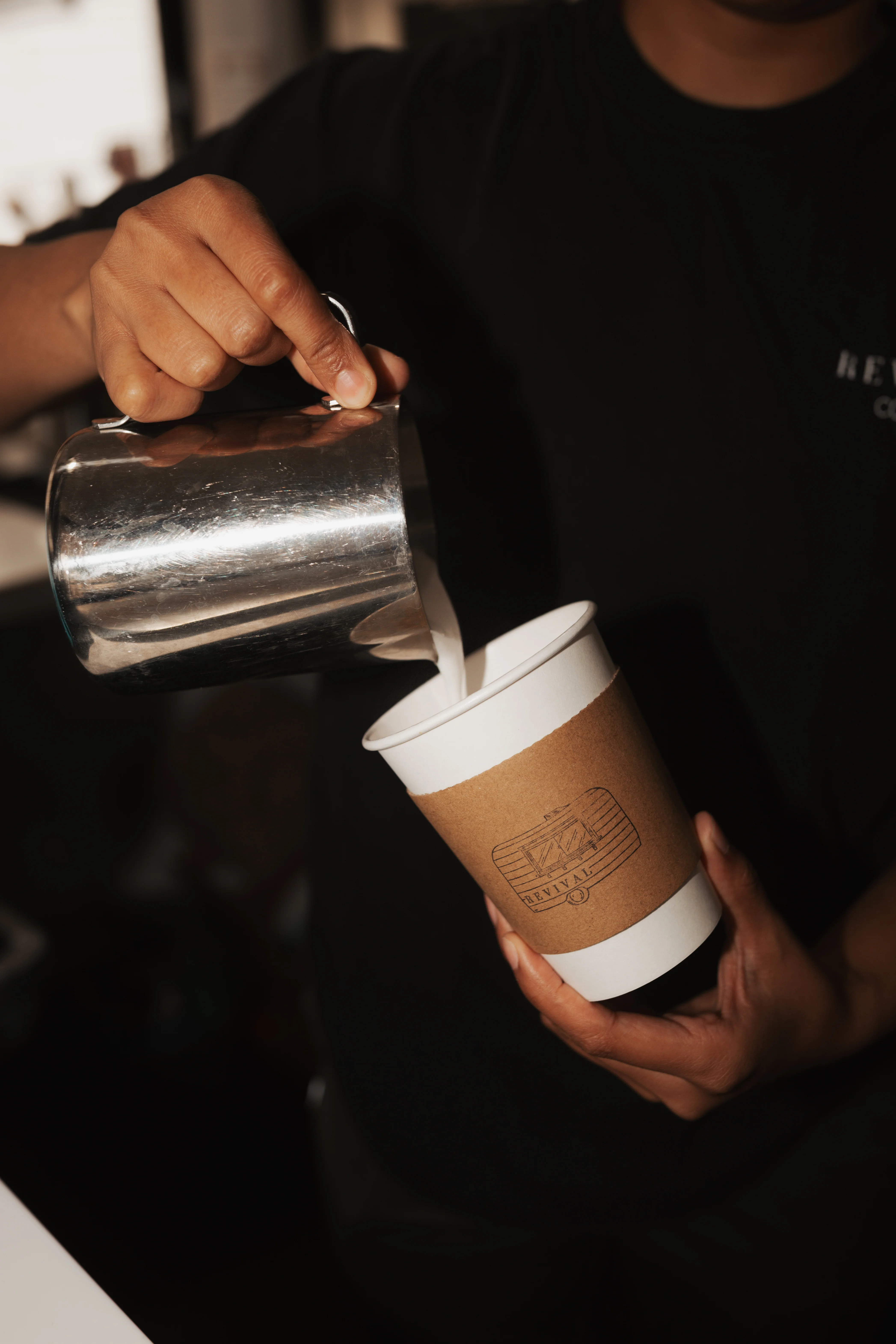 Coffee being steamed and prepared at Revival Coffee Savannah