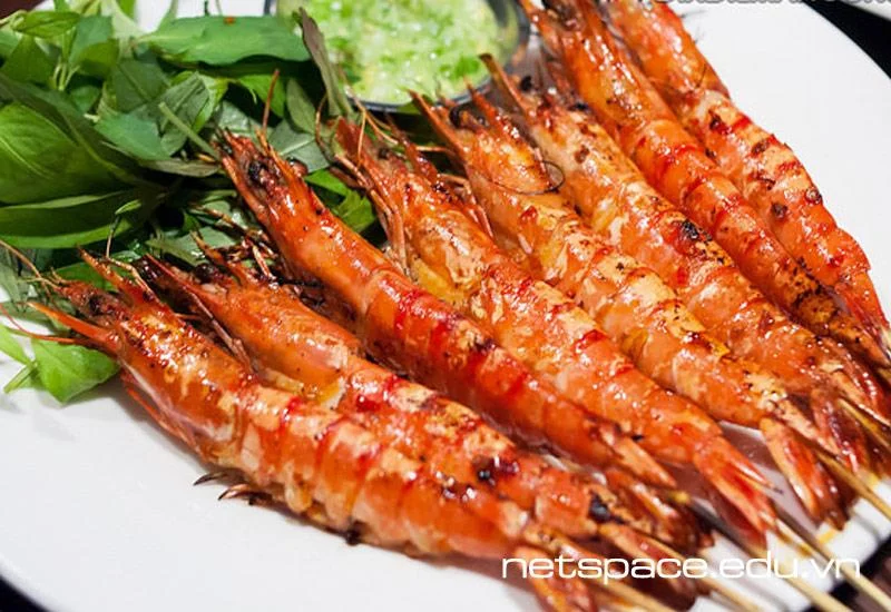 Grilled Vietnamese shrimp skewers with fresh herbs