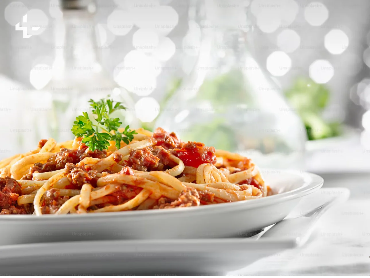 Plate of spaghetti bolognese garnished with parsley