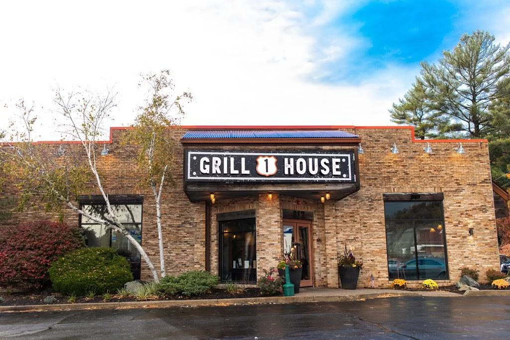 Exterior view of Grill 1 House restaurant with rustic brick facade
