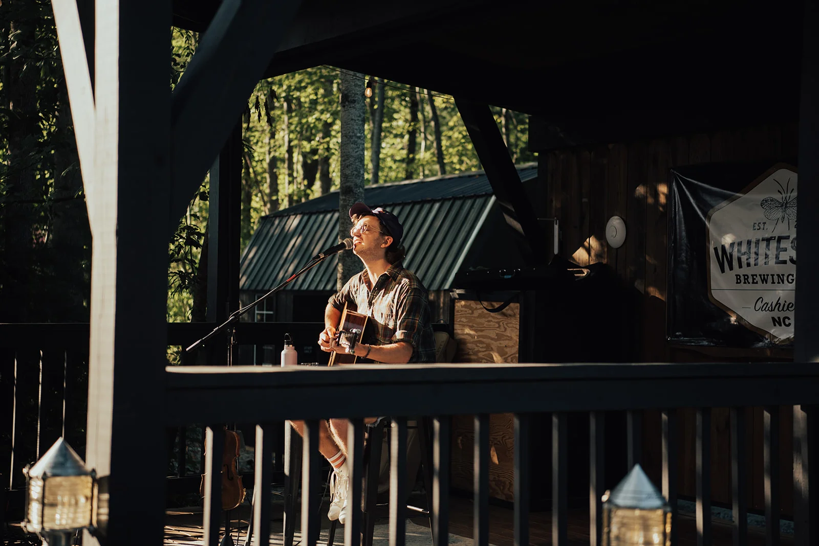 Live music performance at a brewery in a forest setting