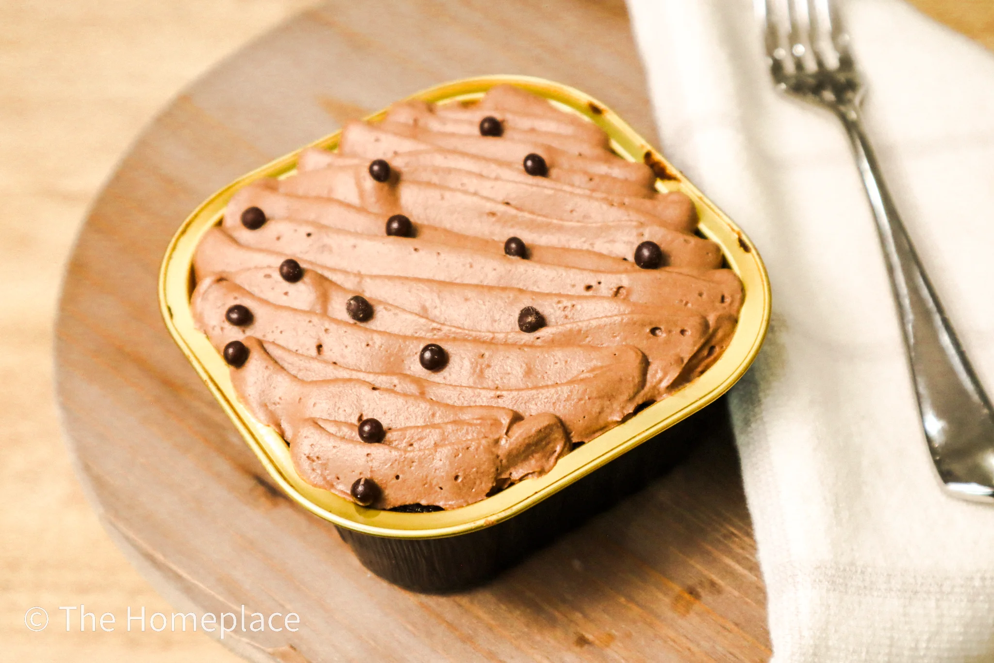 Decadent chocolate mousse dessert in a gold dish