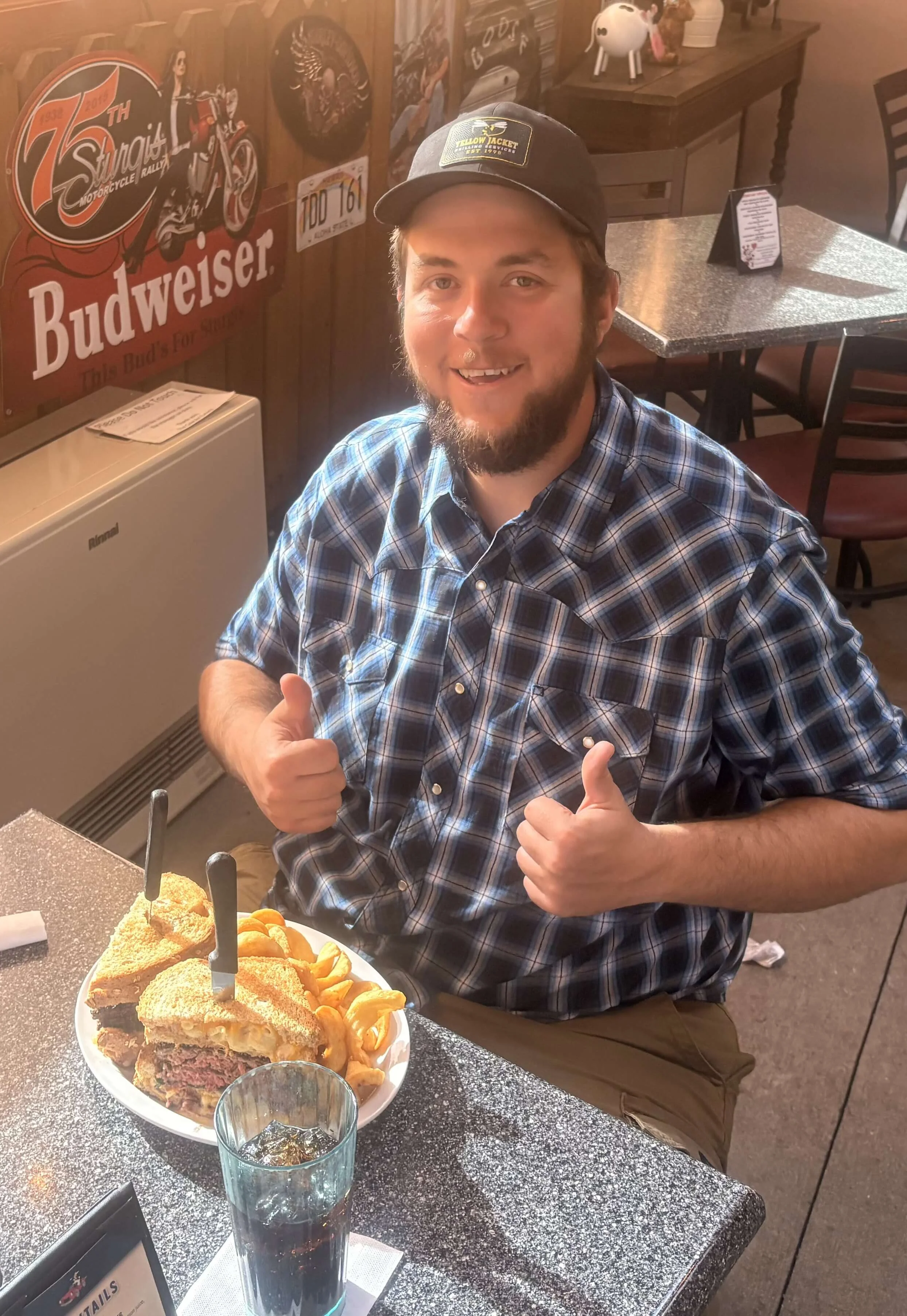 Hearty Reuben sandwich with fries in a casual dining setting