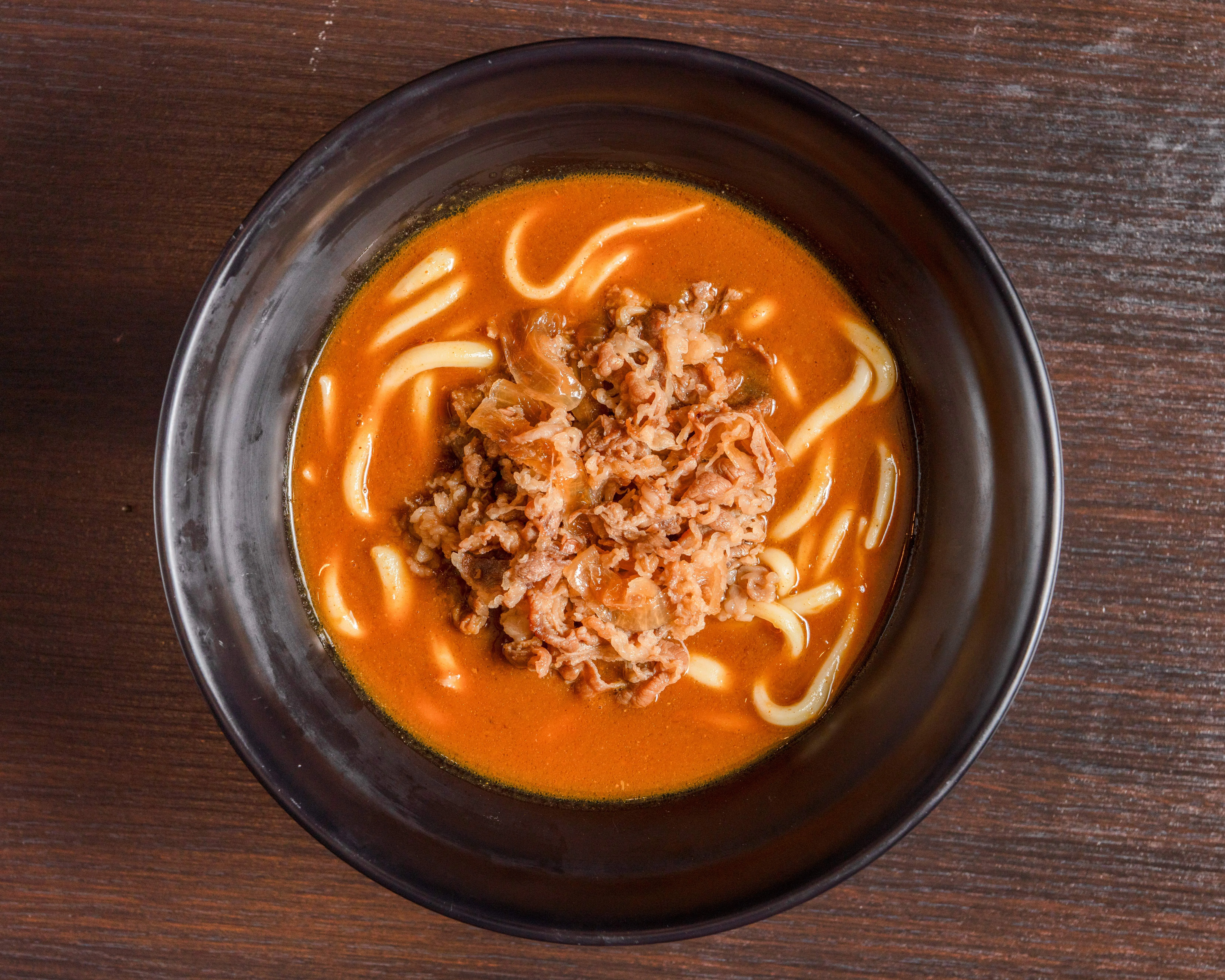 Korean spicy beef udon in a rich broth
