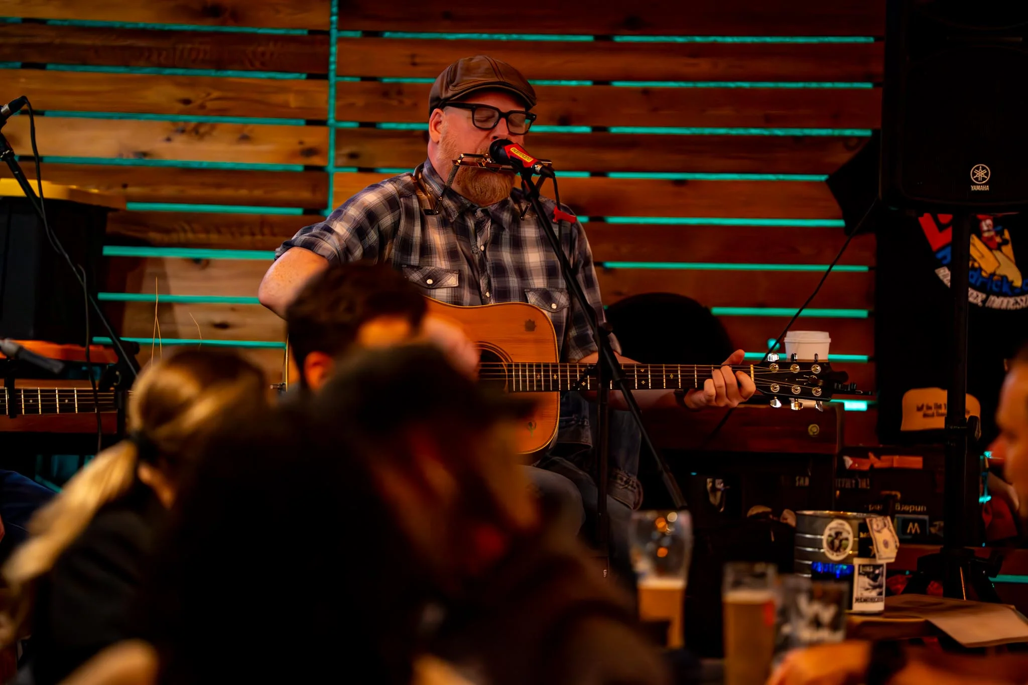Live music performance in a cozy restaurant with wooden decor