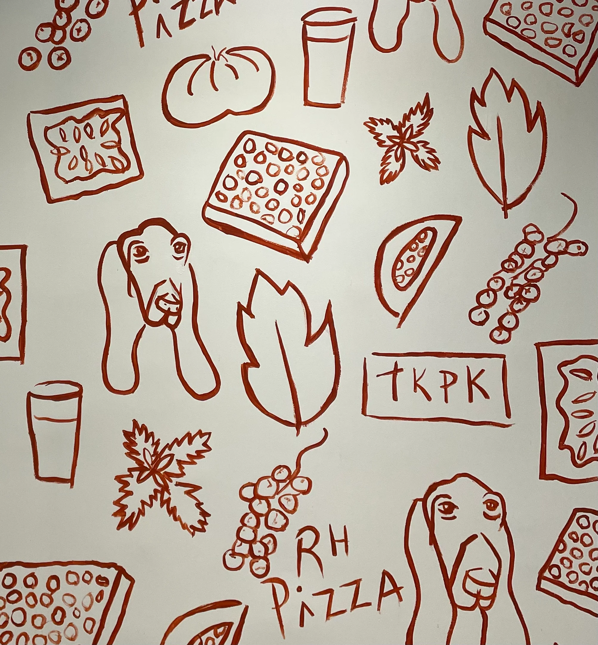 Artistic pizza-themed mural with playful illustrations