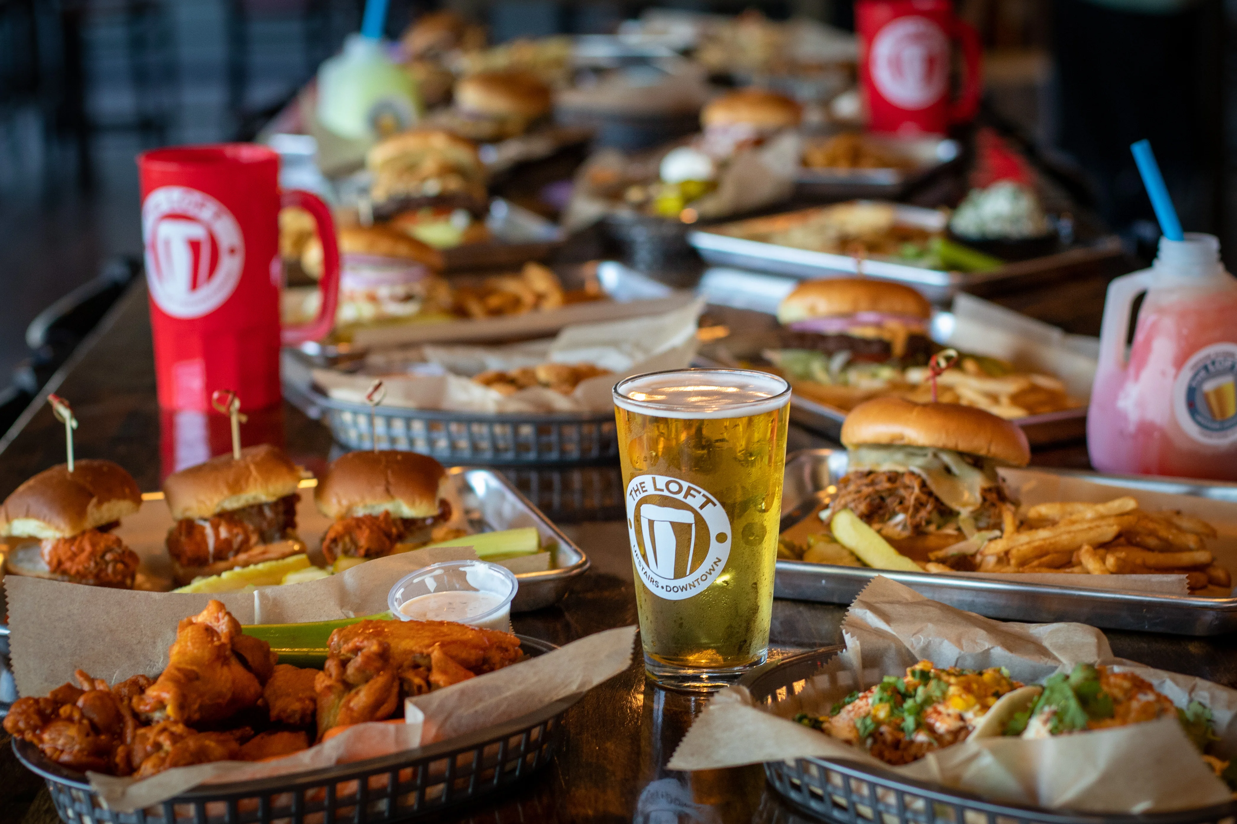 Assorted American pub food with beer and sliders