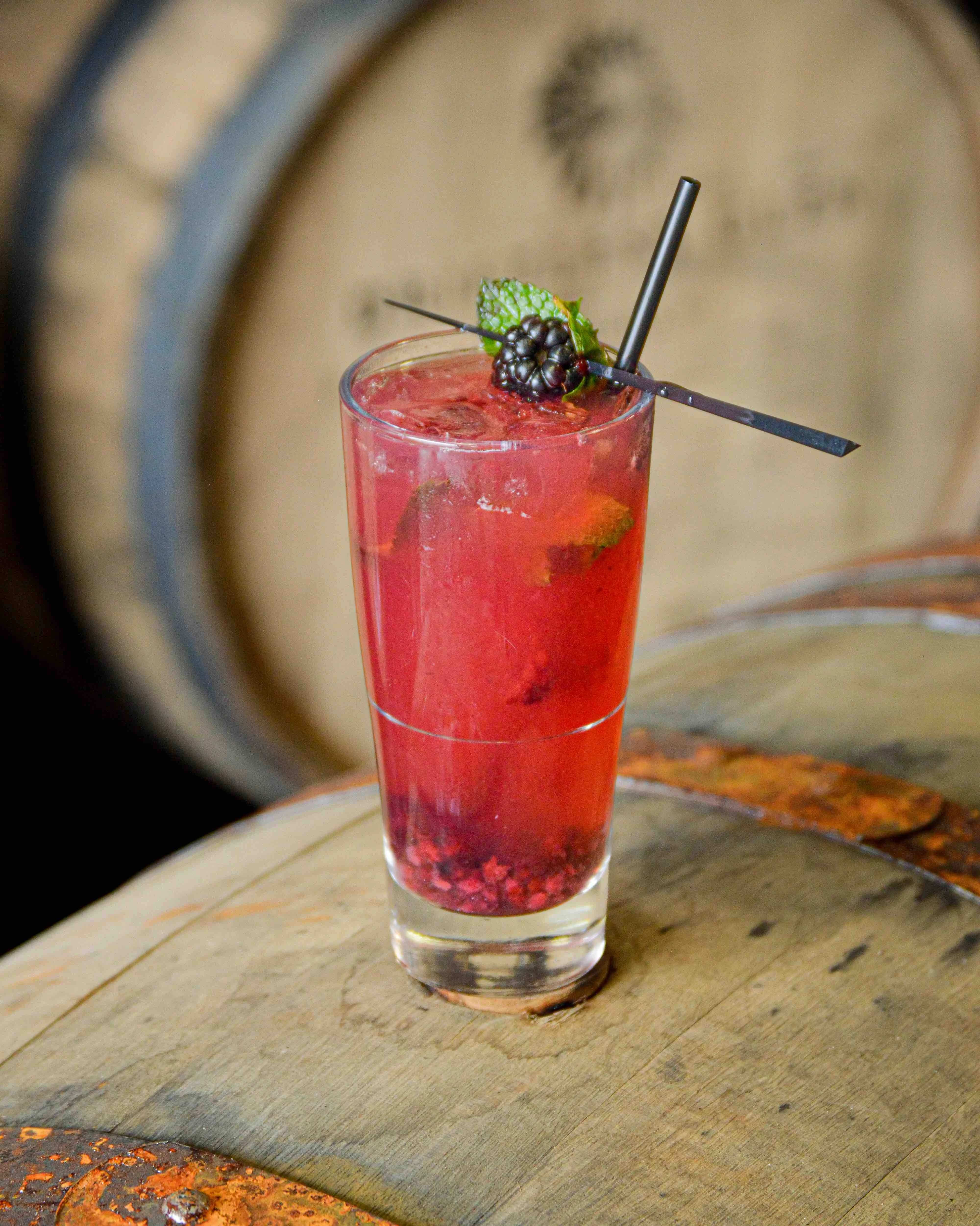 Bourbon Smash cocktail on a barrel