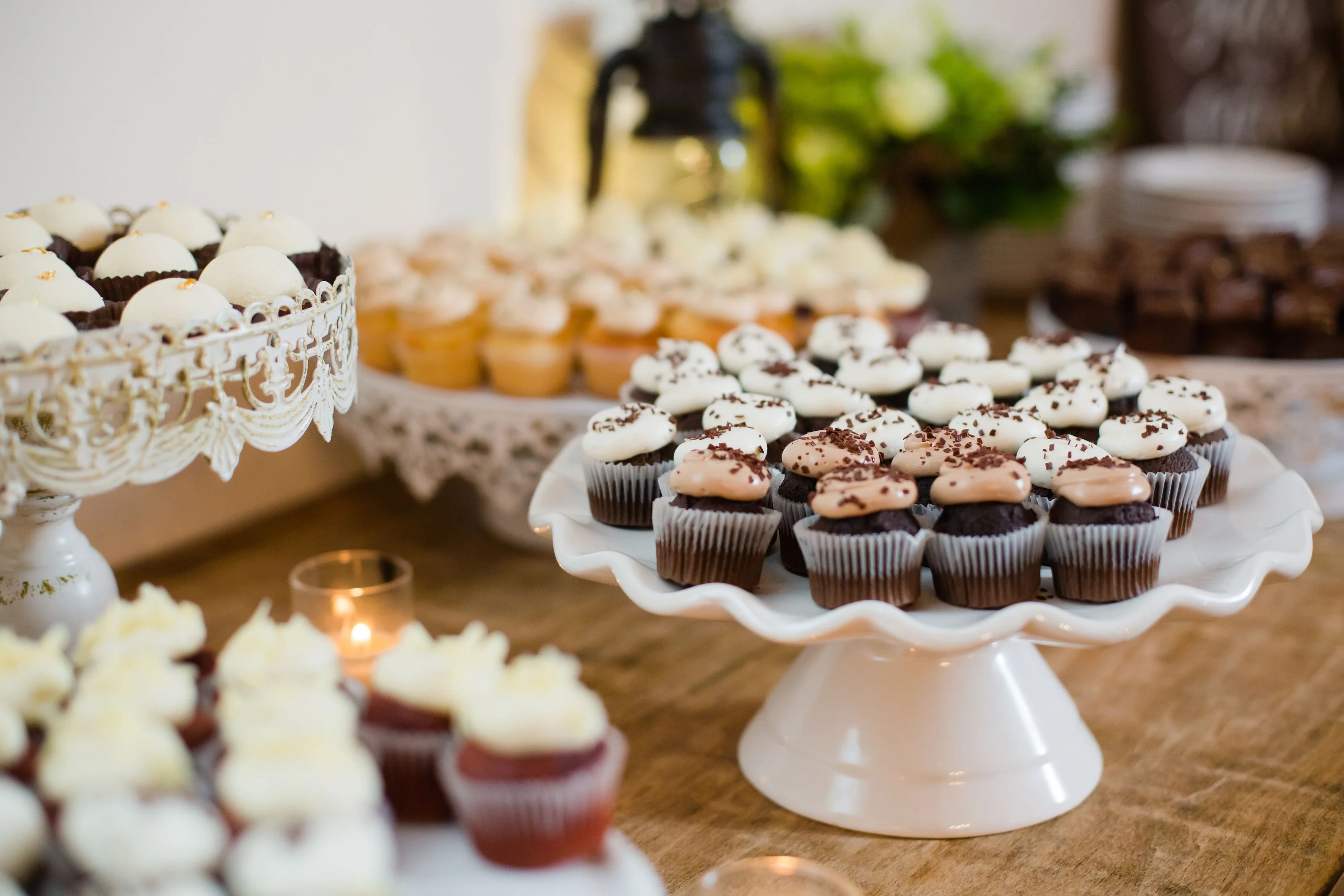 Assorted gourmet cupcakes on elegant stands