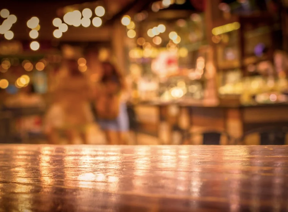 Cozy restaurant interior with warm lighting and blurred background