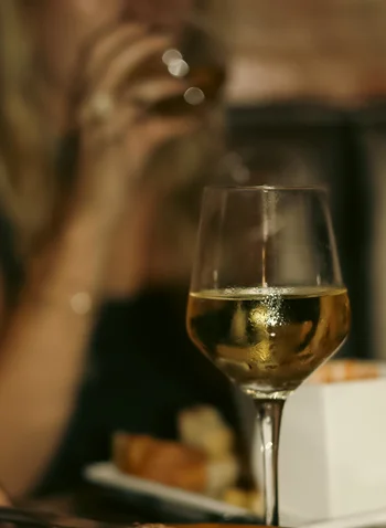 Happy hour drinks and appetizers on a table at a restaurant