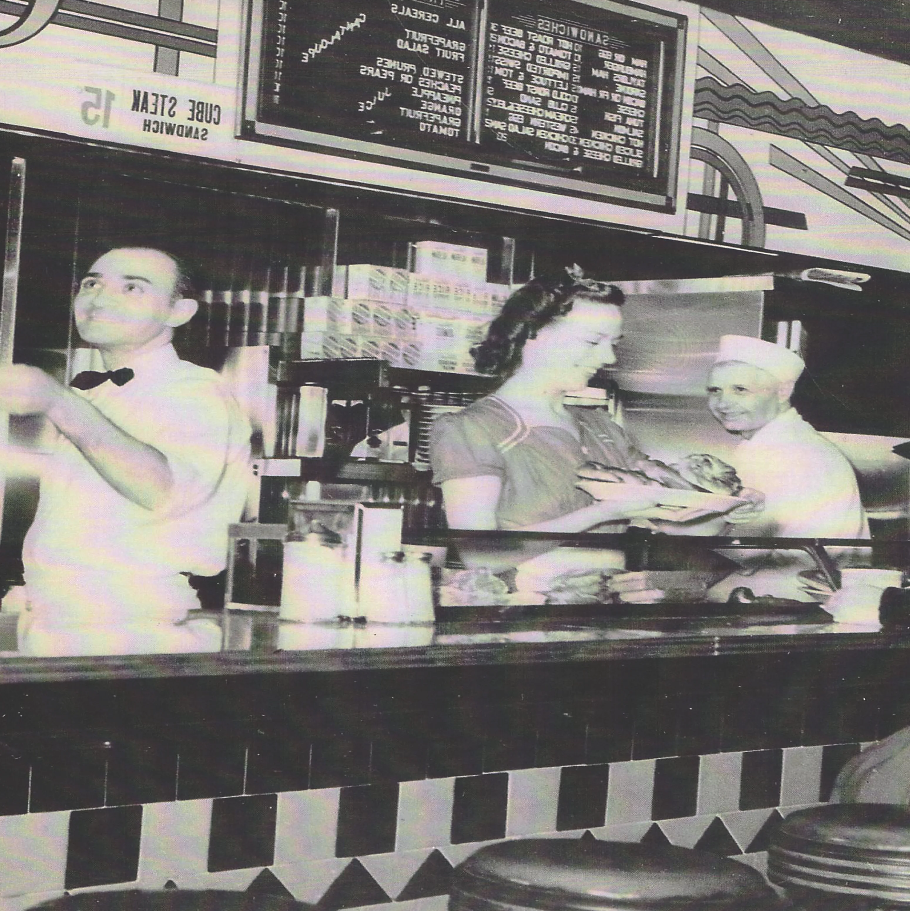 Vintage diner scene with staff and customers