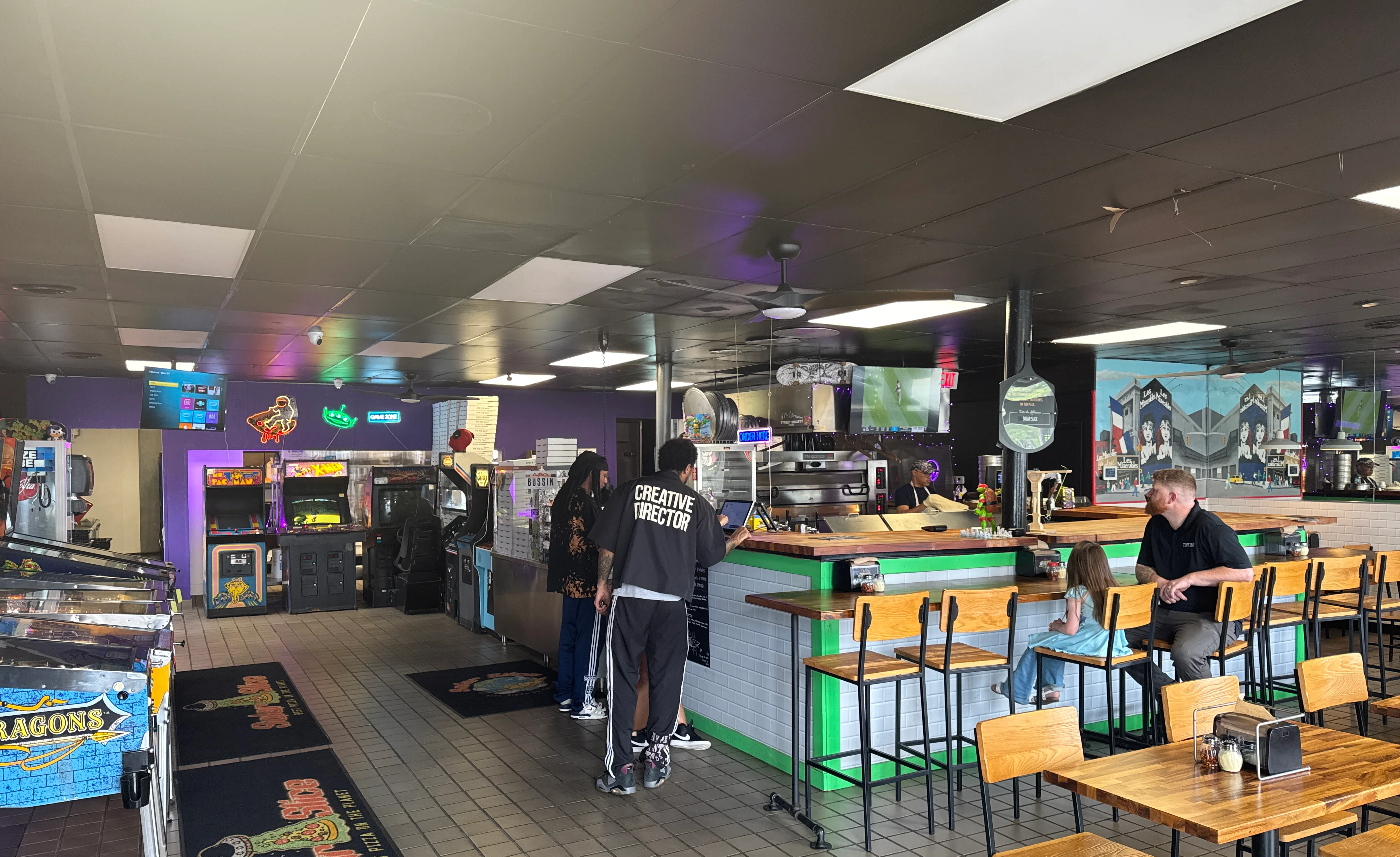 Vibrant restaurant interior with arcade games and seating