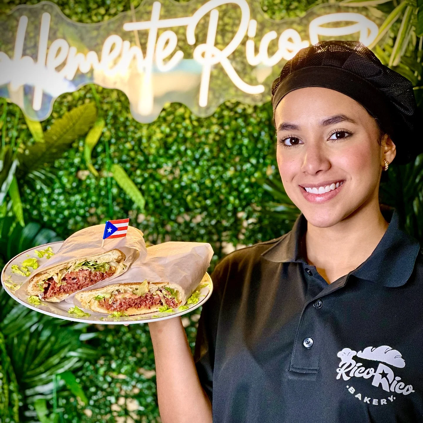 A young lady holding an authentic Puerto Rican dish