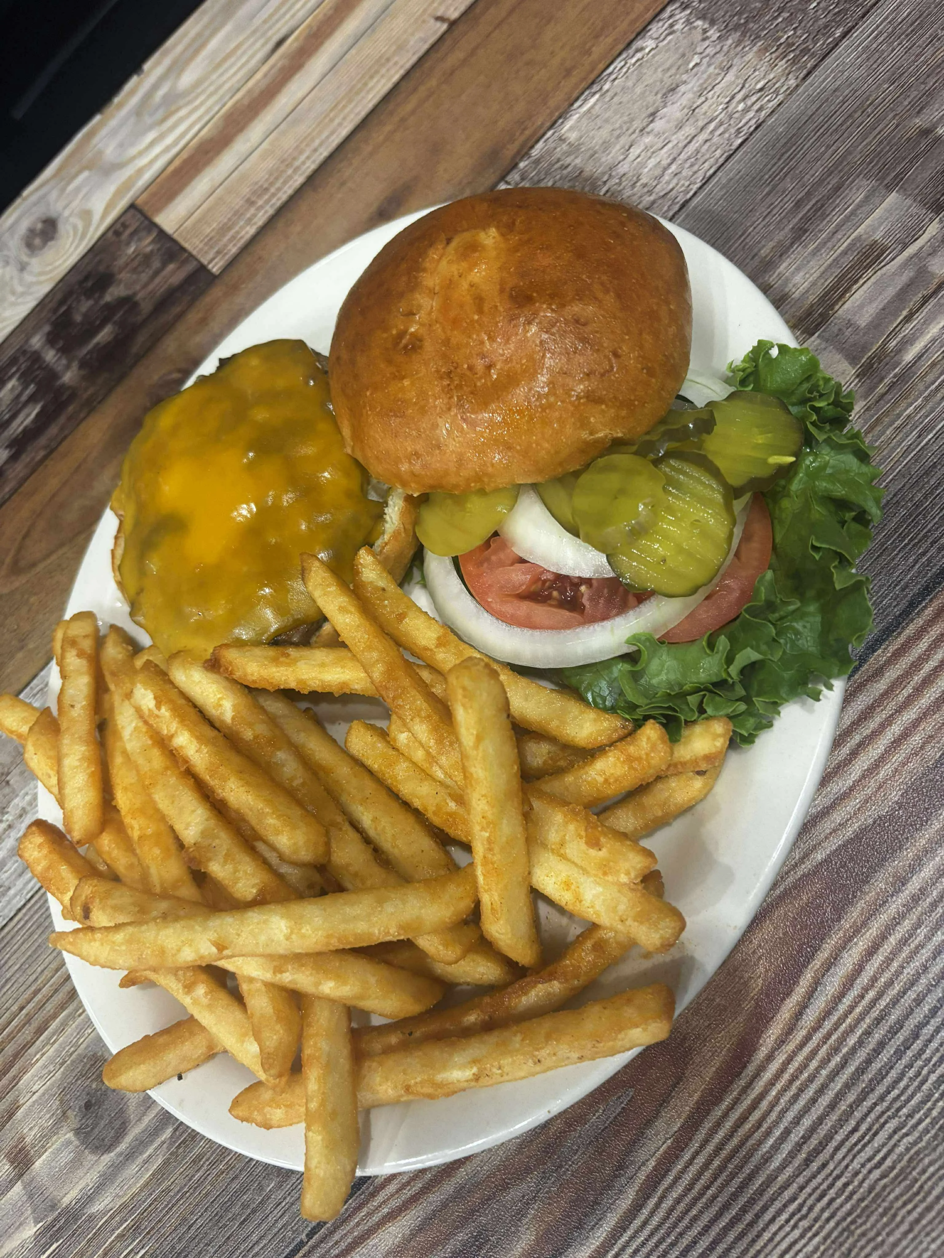 Classic American cheeseburger with fries