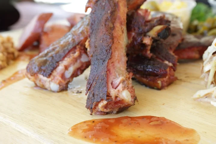 Smoky barbecue ribs served with tangy sauce