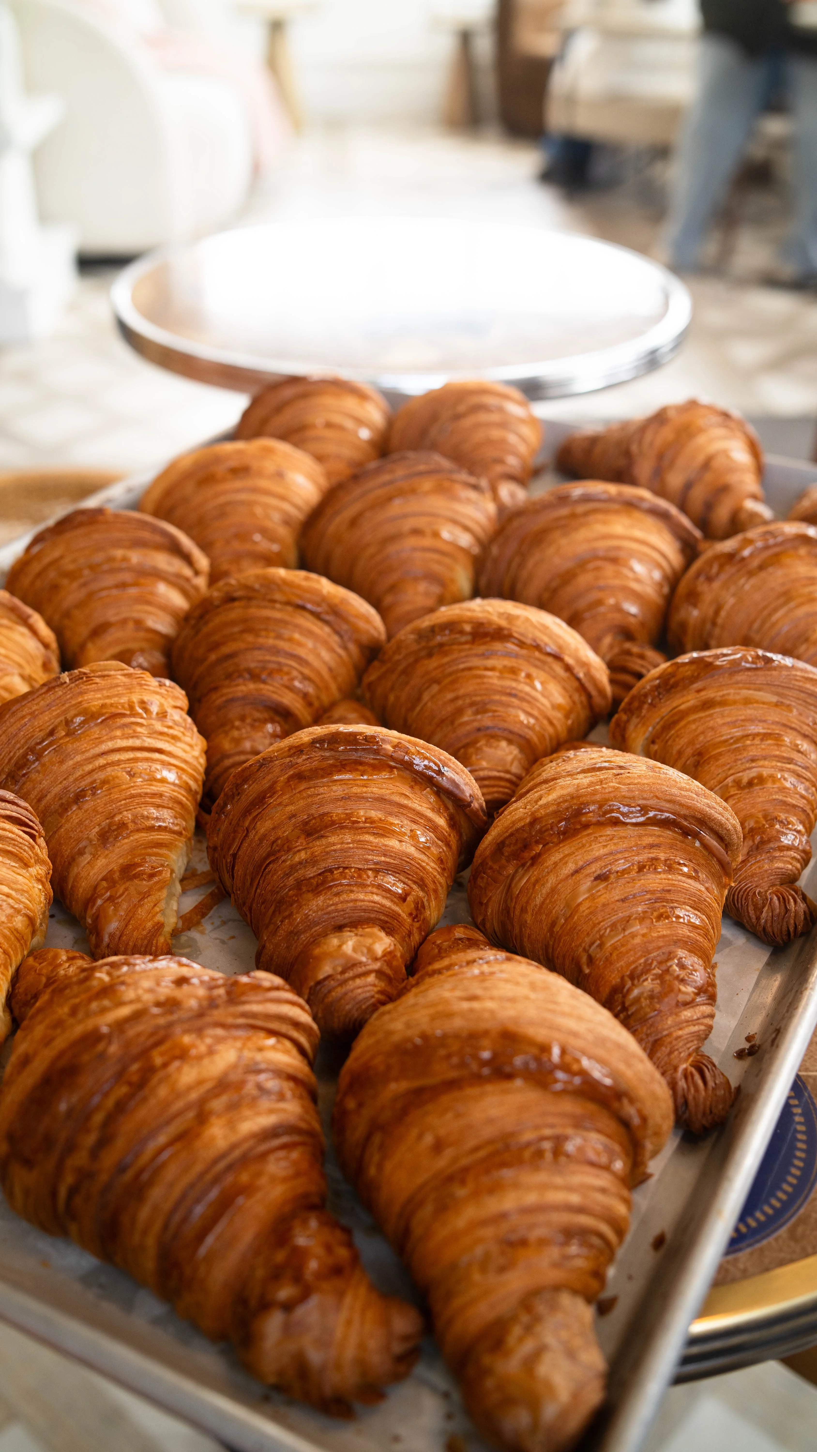 Freshly baked clean croissant on a white plate