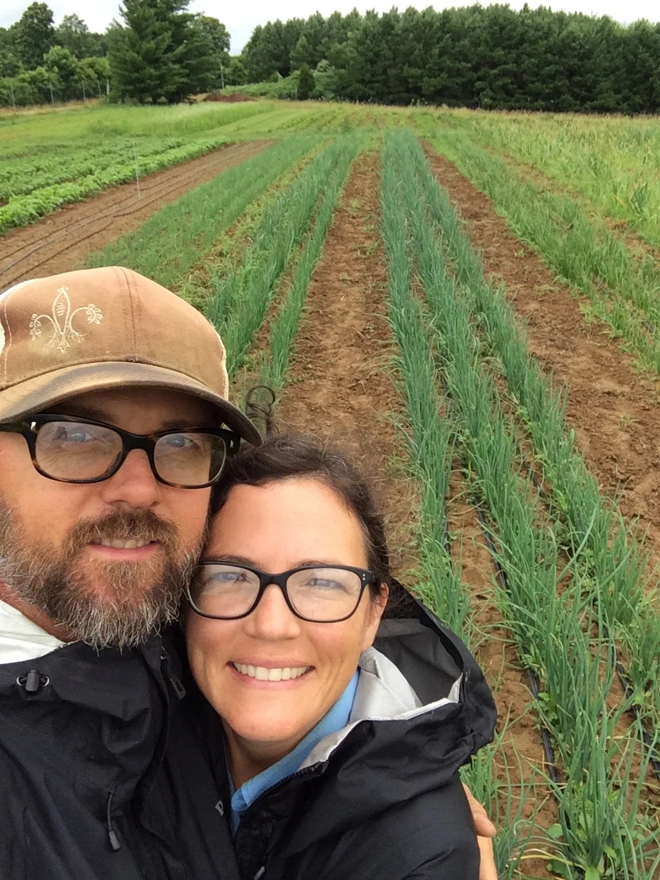 Couple enjoying a large meal featuring Blue Meadow Beef.