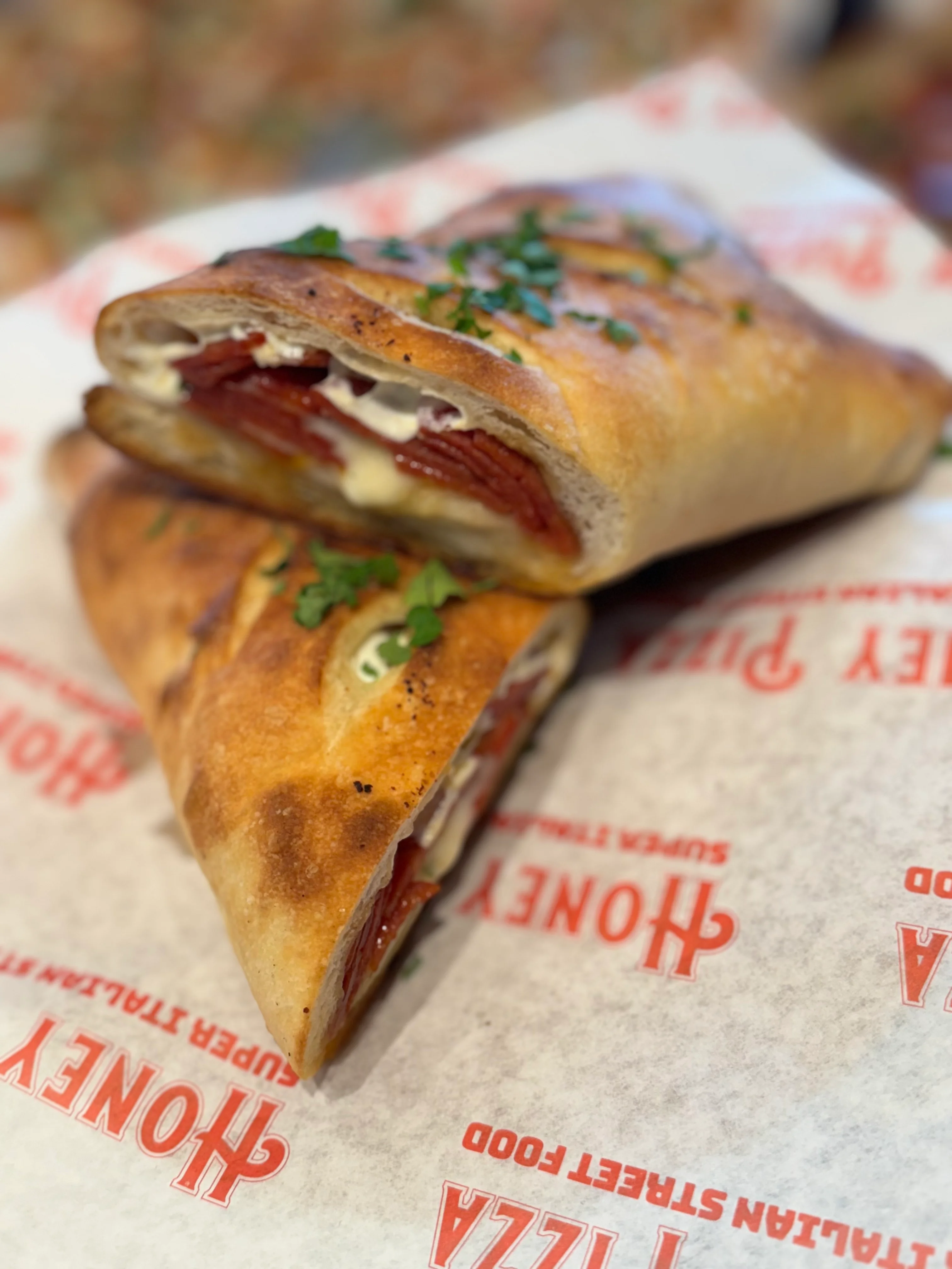 Italian calzone stuffed with meats and cheese