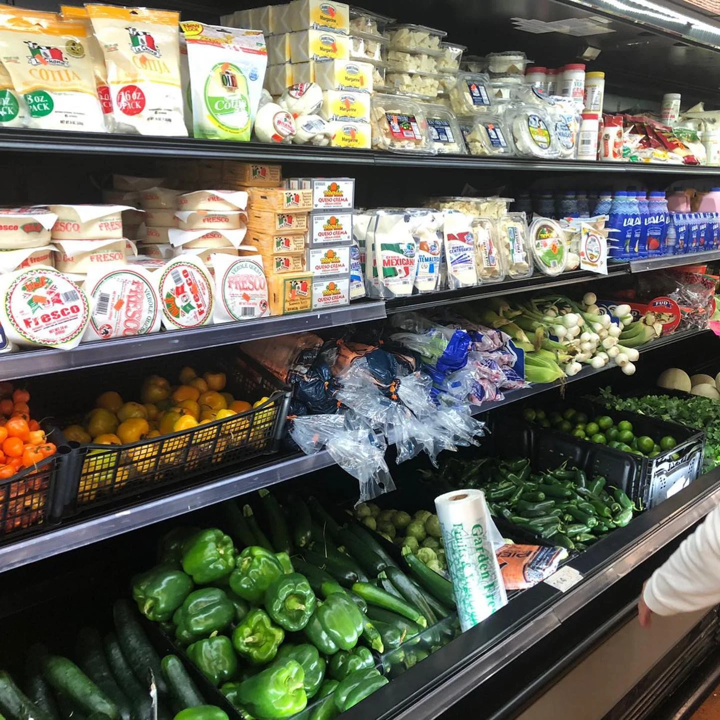 Colorful grocery display of fresh produce and dairy products