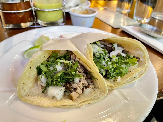 Authentic Mexican street tacos with cilantro and onions